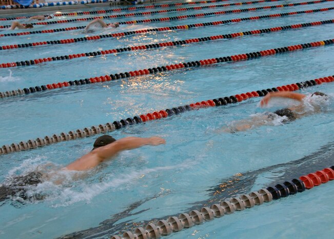Triathlon contestants swim the 450 meters portion of the triathlon Aug. 23 on Charleston AFB. Other events during the triathlon were a 14,500 meter bicycling portion and a 5,000 meter run. The fitness center held the fifth annual triathlon to test people's fitness and allow a healthy extracurricular activity. (U.S. Air Force photo/Airman 1st Class Katie Gieratz)