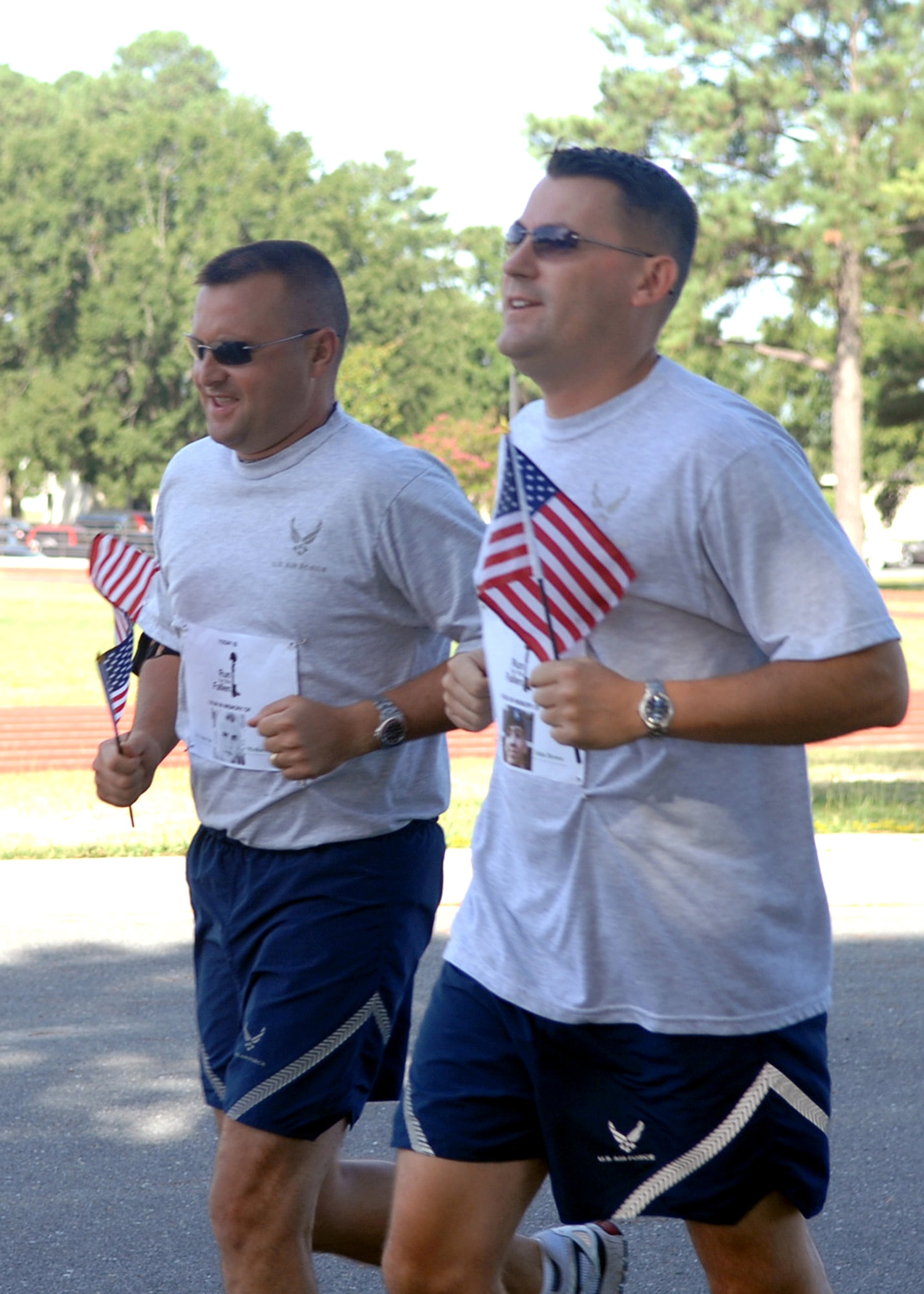 Technical Sergeant Marvin Glass and Master Sgt. Strother Brown run in Run for the Fallen on Seymour Johnson Air Force Base, NC, August 24. Run for the Fallen was a two-mile run to honor military members who lost their lives in Operation Iraqi Freedom and Operation Enduring Freedom. (U.S. Air Force photo by Airman 1st Class Makenzie Lang)