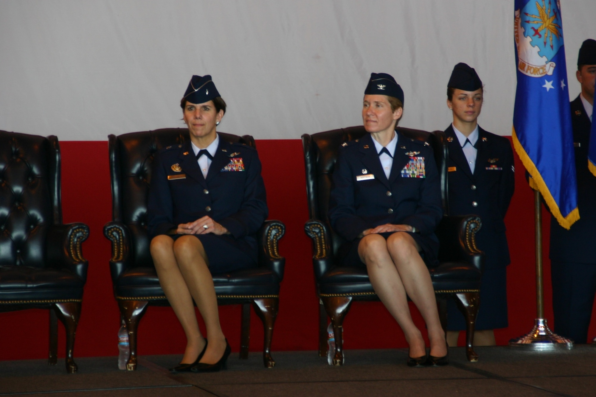 The outgoing and incoming commanders of the 552nd Air Control Wing sit side by side during the change of command ceremony. Photo Courtesy of 2nd Lt. Kinder Blacke.
