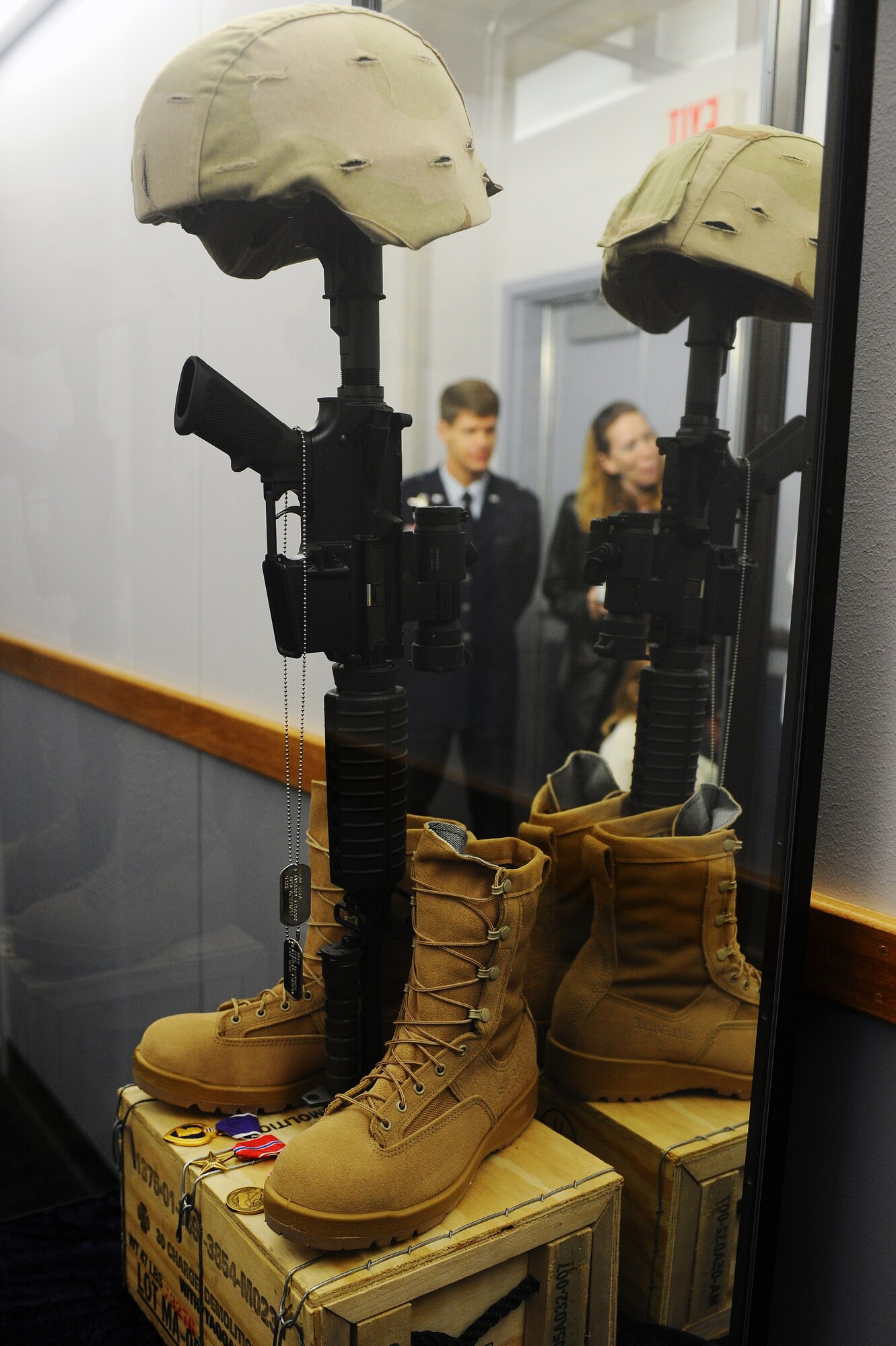 Mrs. Rebecca Clemmons and Brig. Gen. Mark Graper, 354th Fighter Wing commander, take a moment of silence and reflection as they look at Master Sgt. Brad Clemmon's, 354th Civil Engineer Squadron explosive ordnance disposal flight, memorial Aug. 21, 2008, at Eielson Air Force Base, Alaska. Sergeant Clemmons family, friends and co-workers attended the building dedication ceremony to honor his ultimate sacrifice.  (U.S. Air Force photo by Airman 1st Class Jonathan Snyder)