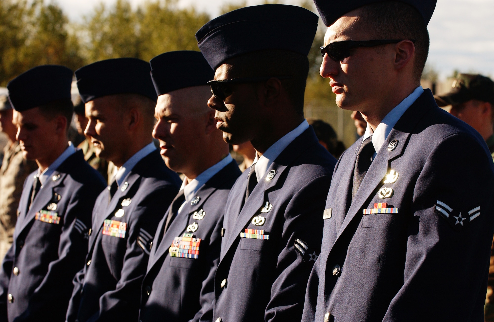 Fellow Airmen of the 354th Civil Engineer Squadron explosive ordnance disposal flight pay their respects during Master Sgt. Brad Clemmon's memorial dedication ceremony Aug. 21, 2008, at Eielson Air Force Base, Alaska. Sergeant Clemmon's family, friends and co-workers attended the building dedication ceremony to honor his ultimate sacrifice.  (U.S. Air Force photo by Airman 1st Class Jonathan Snyder)