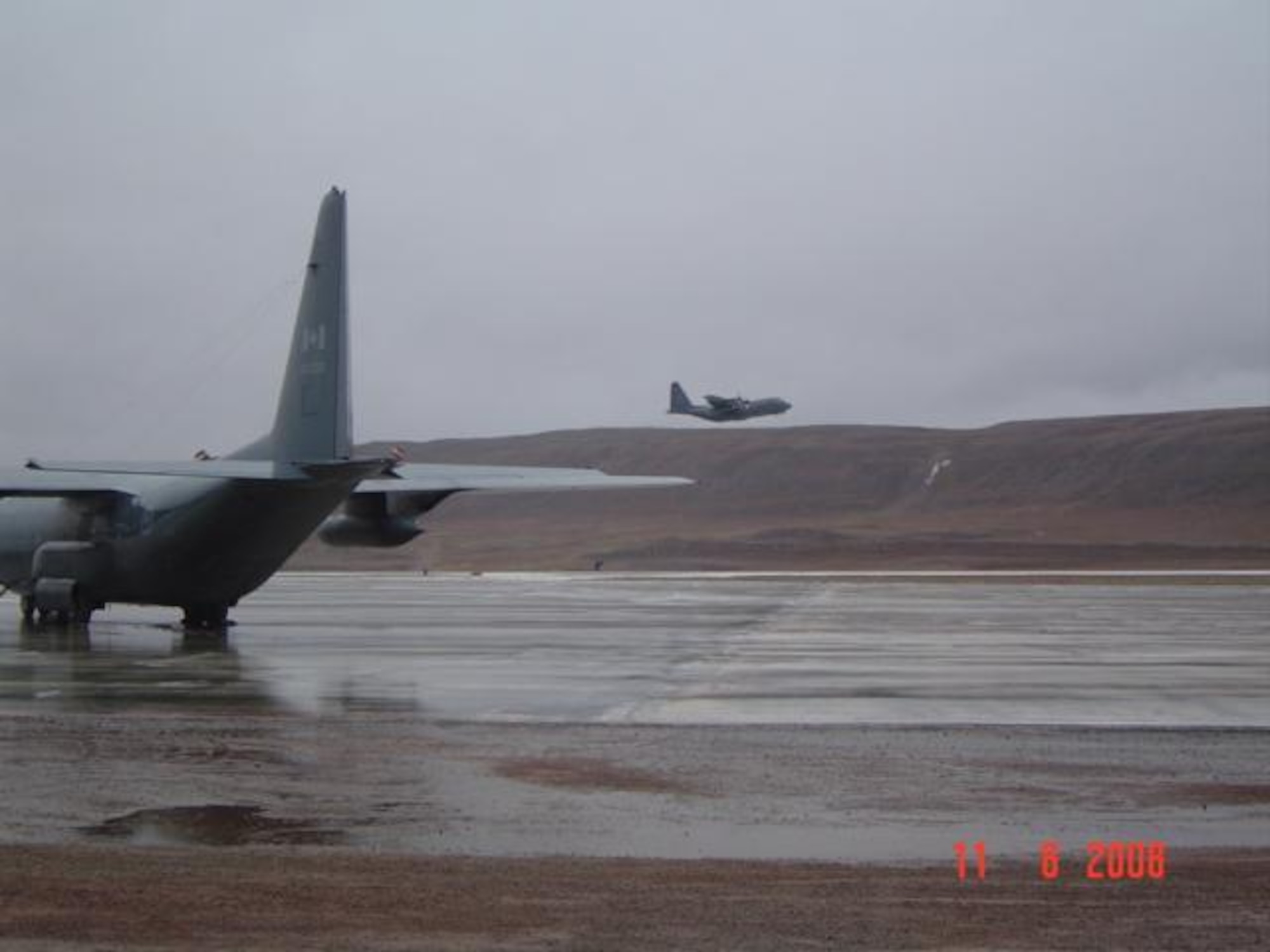 Overcast skies and light rain welcomed BOXTOP 01, Canadian C-130, into the skies above Thule AB, Greenland.  BOXTOP 01 commenced the start of Operation BOXTOP II/08 on this departure to CFS Alert, some 440 nautical miles north of Thule AB.  2008 marks the 50th anniversary of CFS Alert. (US Air Force photo/Capt Michael R. Balzotti)