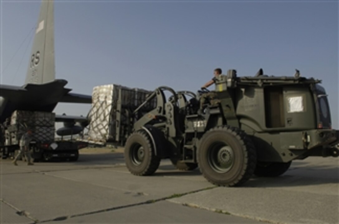 U.S. Air Force airmen assigned to the 720th Air Expeditionary Squadron unload pallets of meals, ready-to-eat, sleeping bags and cots on a flight line in Tbilisi, Georgia, on Aug. 23, 2008.  The joint humanitarian assistance assessment team with U.S. European Command is working with the federal government, international governments, aid agencies and the Republic of Georgia to assist Georgians affected by the recent conflicts.  