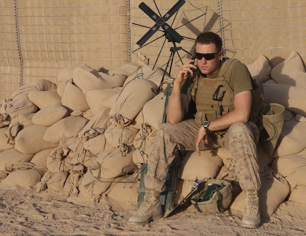 HELMAND PROVINCE, Afghanistan – First Lieutenant Matthew Pelnar, the artillery liaison officer assigned to Company F, Task Force 2d Battalion, 7th Marine Regiment, 1st Marine Division, and native of Cresskill, N.J., native, uses a radio to coordinate instructions for an upcoming assault. (U.S. Marine Corps photo by Cpl. James M. Mercure)