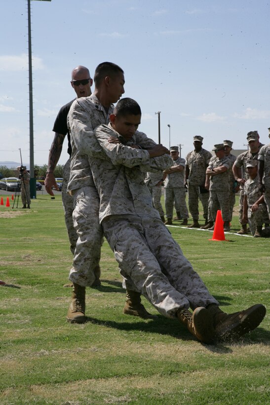 Sgt. Khanh Nguyen, a logistics clerk for Marine Corps Recruit Depot San Diego, buddy drags Sgt. Salvador Morales-solis, admin chief for Marine Corps base Camp Pendleton, during the Combat Fitness Test demonstration for the Marine Corps Training and Education Command’s Fitness Roadshow at the Combat Center Aug. 28.