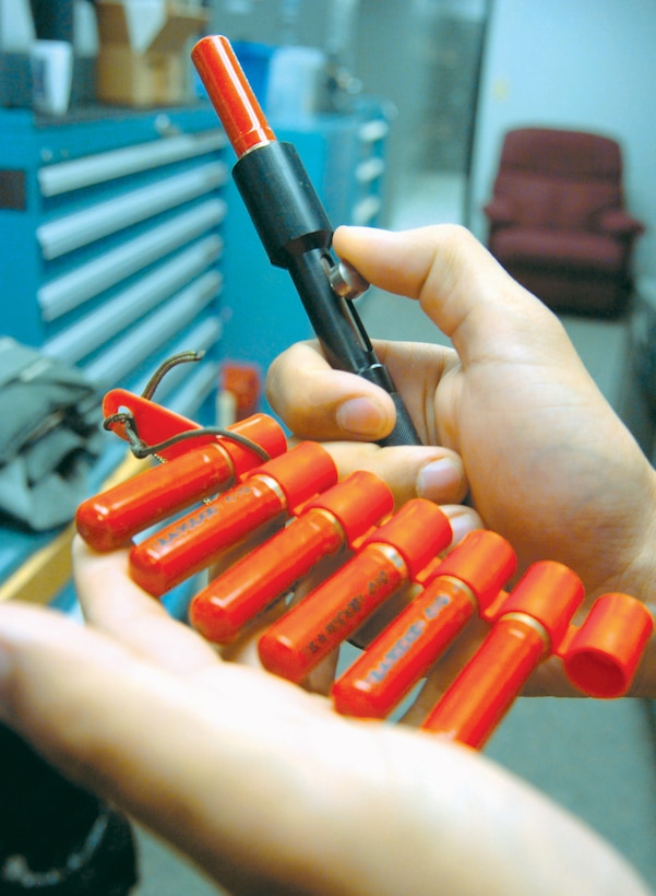 The penguin is a survival signaling device used if an aircrew member is in need of assistance. This valuable life saving device shoots a flare up to 1,250 feet in the sky, through trees and burns for nine seconds.