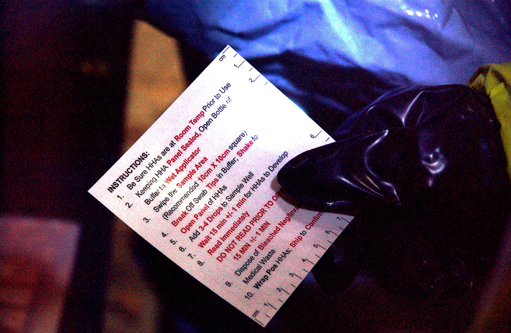 Staff Sgt. Michael Huntington of the 354th Civil Engineer Squadron reads off of an instruction checklist to operate a DoD Biological Sampling Kit at a hazardous readiness exercise Aug. 28, 2008. The sampling kit will help to identify various biological agents. (U.S. Air Force photo/Airman 1st Class Willard E. Grande II)