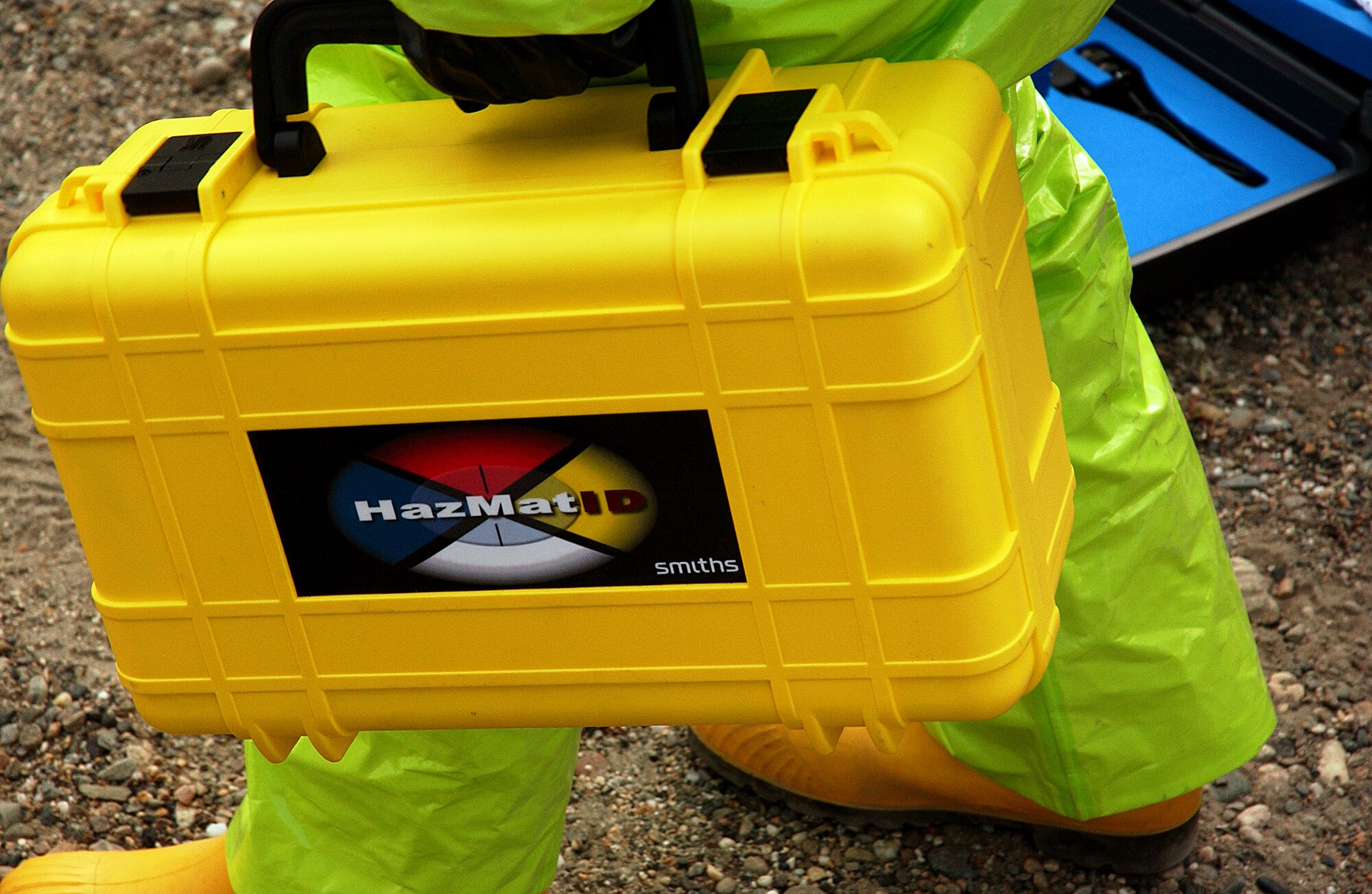 Staff Sgt. Michael Huntington of the 354th Civil Engineer Squadron carries a  HazMatID unit to the site at a hazardous readiness exercise Aug. 28, 2008. The identifier will help to recognize various chemicals. (U.S. Air Force photo/Airman 1st Class Willard E. Grande II)