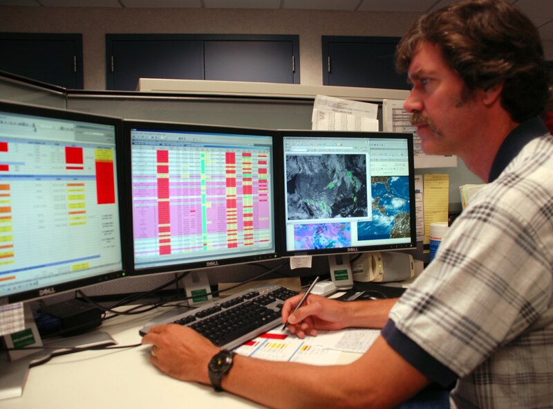 Shawn Dahl, the lead meteorologist with the 618th Tanker Airlift Control Center Weather Cell, keeps an eye on the satellite picture that shows the location of Hurricane Gustav.
