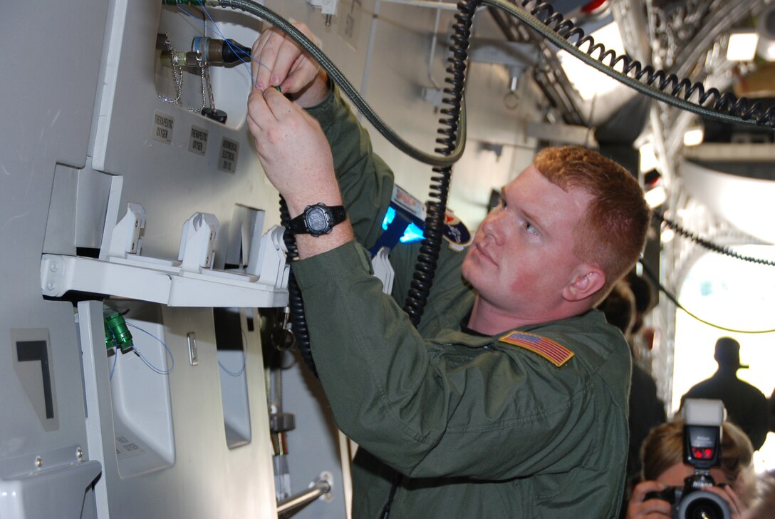 932nd Aeromedical Evacuation Squadron crew members joined up with crews from several states to take care of a simulated "patient" by getting power connected during a training event at the AE Jamboree 2008 held at Scott Air Force Base. The crew went on a C-17 flight to train for several hours. Photo by Tech. Sgt. Danny Oliver 