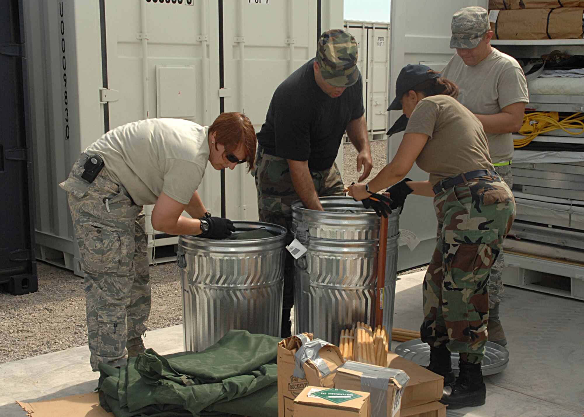 Members of the BEAR to BoB validation team and the 49th Materiel Maintenance Support Squadron take inventory on the contents of a billeting unit type code. (U.S. Air Force photo/Staff Sgt. Terri Barriere)
