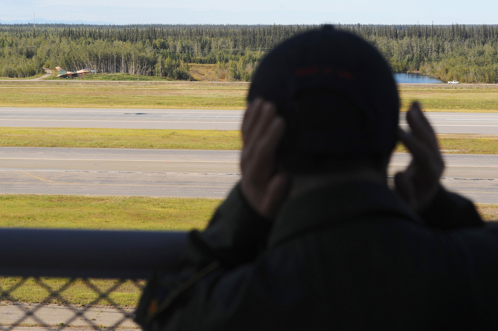 Alex Lee covers his ears as he watches an F-16 Fighting Falcon take off Aug. 22 at Eielson Air Force Base, Alaska. Alex was born with congenital heart defects and Down syndrome and was selected by the Make-A-Wish Foundation for the Pilot for a Day program. The purpose of the program is to ease the pain of children who lost a normal childhood due to illnesses or disabilities. (U.S. Air Force photo/Airman 1st Class Jonathan Snyder) 
