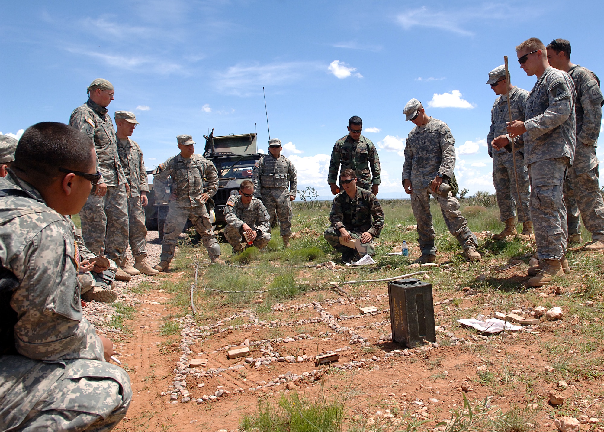 Soldiers from the 1-77th Armor, 4th Brigade, 1st Armor Division, Fort Bliss, Texas, discuss tactics from their previous mission Aug. 12, at McGregor Range, New Mexico.  (U.S. Air Force photo/ Airman 1st Class John D. Strong II)