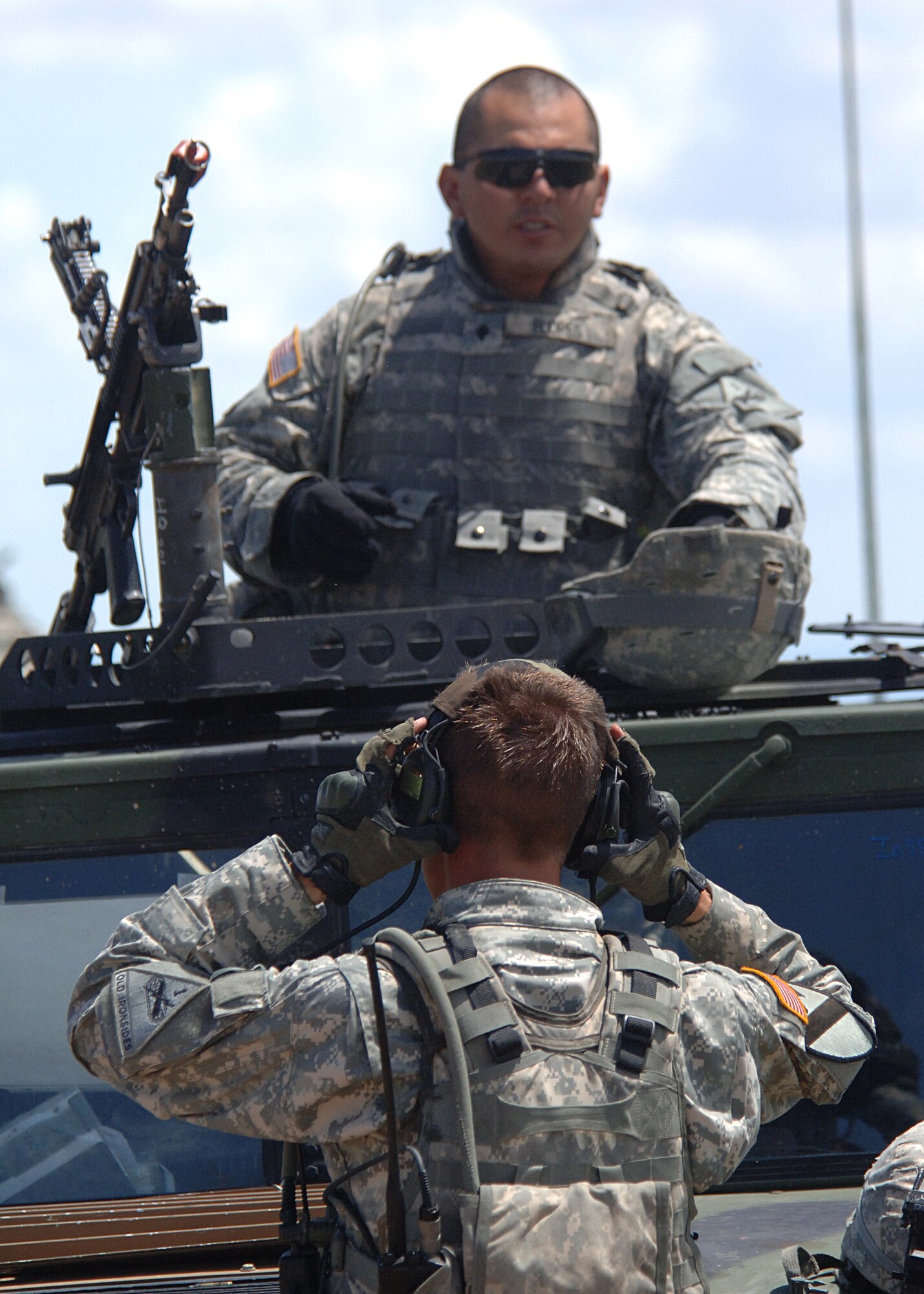 Soldiers from the 1-77th Armor, 4th Brigade, 1st Armor Division, Fort Bliss, Texas, remove their gear after completing a mission Aug. 12, at McGregor Range, New Mexico.  (U.S. Air Force photo/ Airman 1st Class John D. Strong II) 