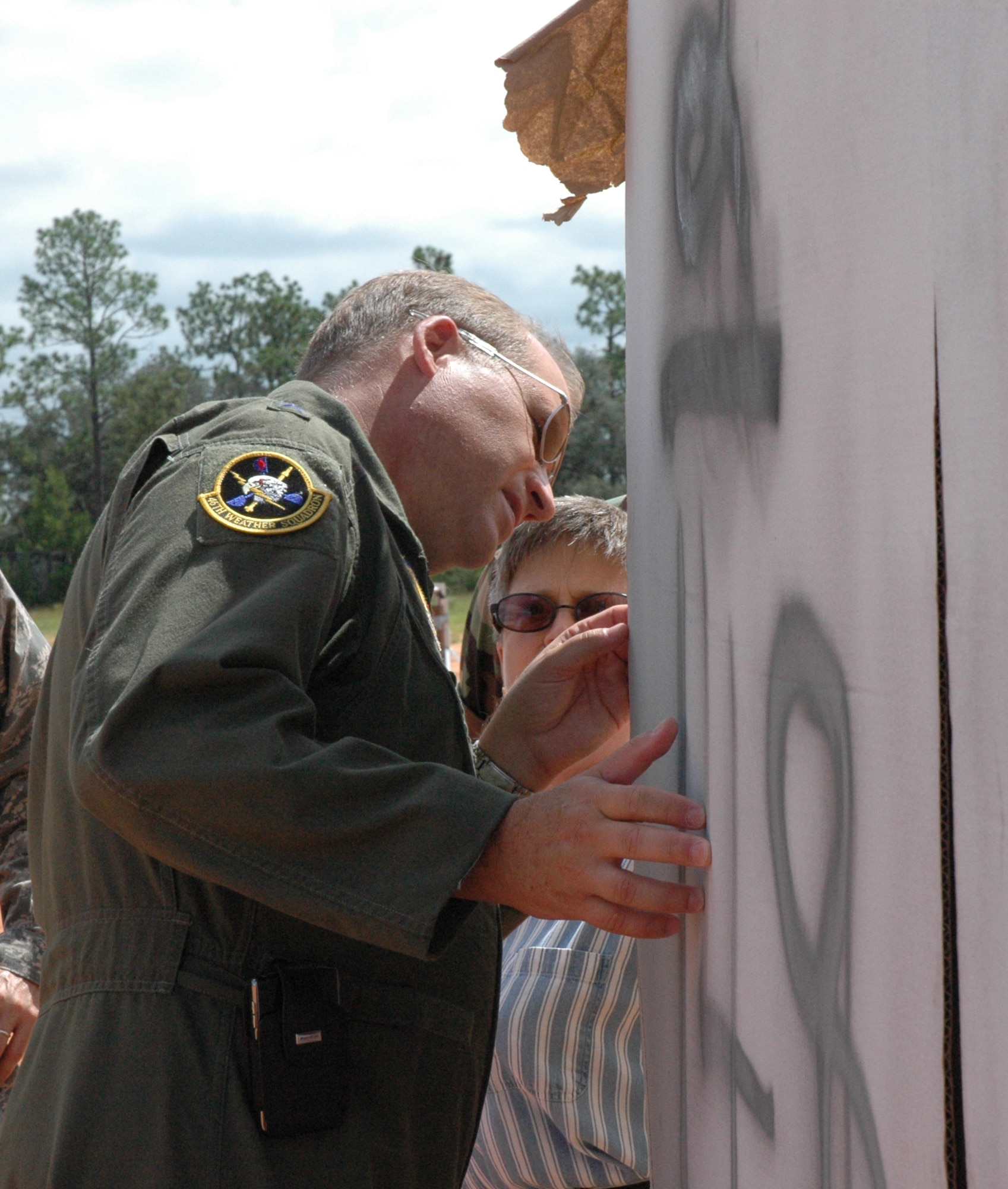 EGLIN AIR FORCE BASE, Fla. -- Ruth Ezell, Tech Director of Air to Surface Test, describes to Maj. Gen. David Eidsuane, Air Armament Center commander and the Air Force Program Executive Officer for Weapons, Air Force Materiel Command, the details of how the instrumentation used in the test will record data of the detonation.