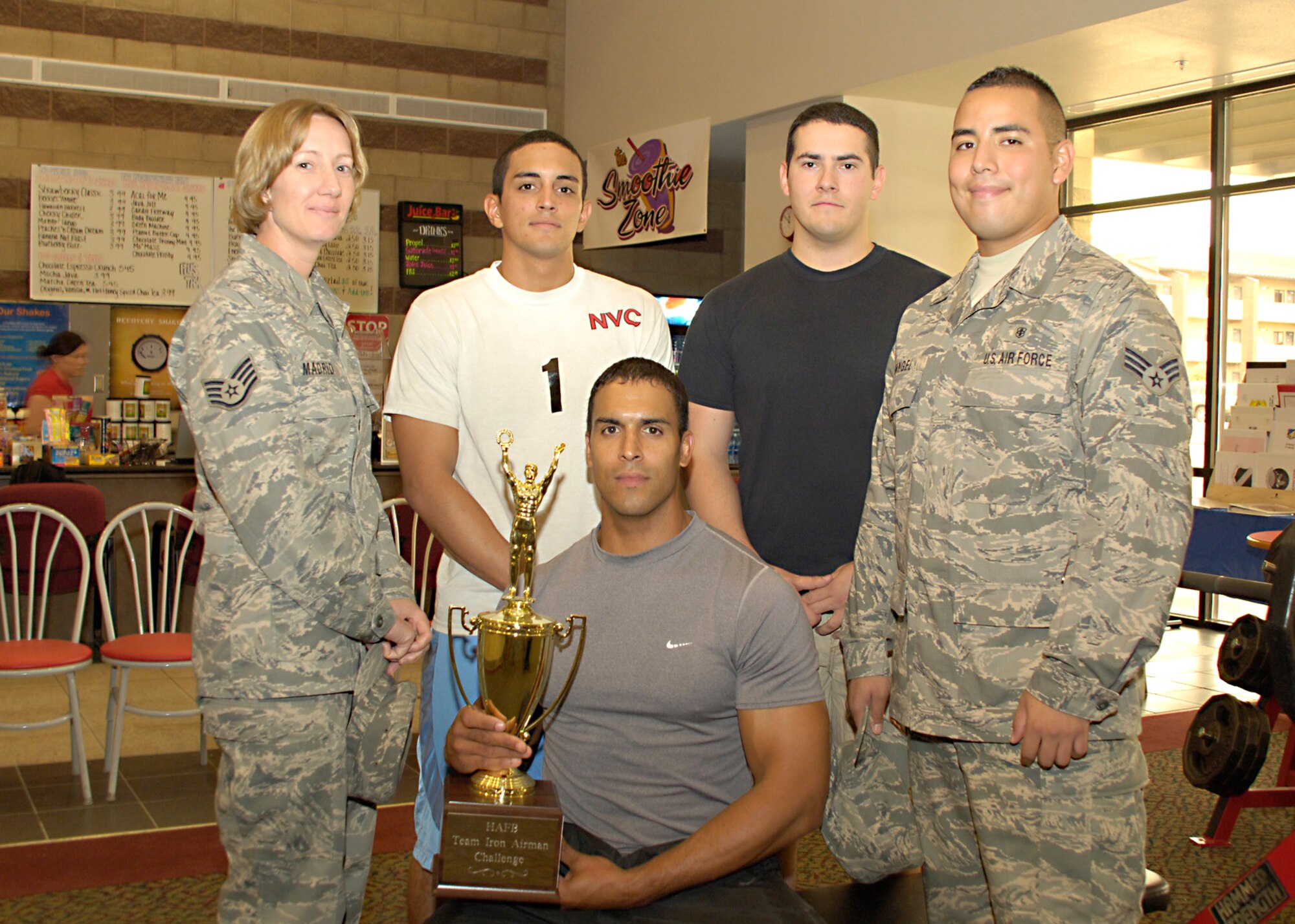 Members from the 49th Medical Group pose with the Iron Airman Challenge trophy at Holloman Air Force Base, N.M., Aug. 27. The medical group beat the 49th Maintenance Group by one point, making them the most recent Iron Airman champions. (U.S. Air Force photo/ Senior Airman Tiffany Trojca)