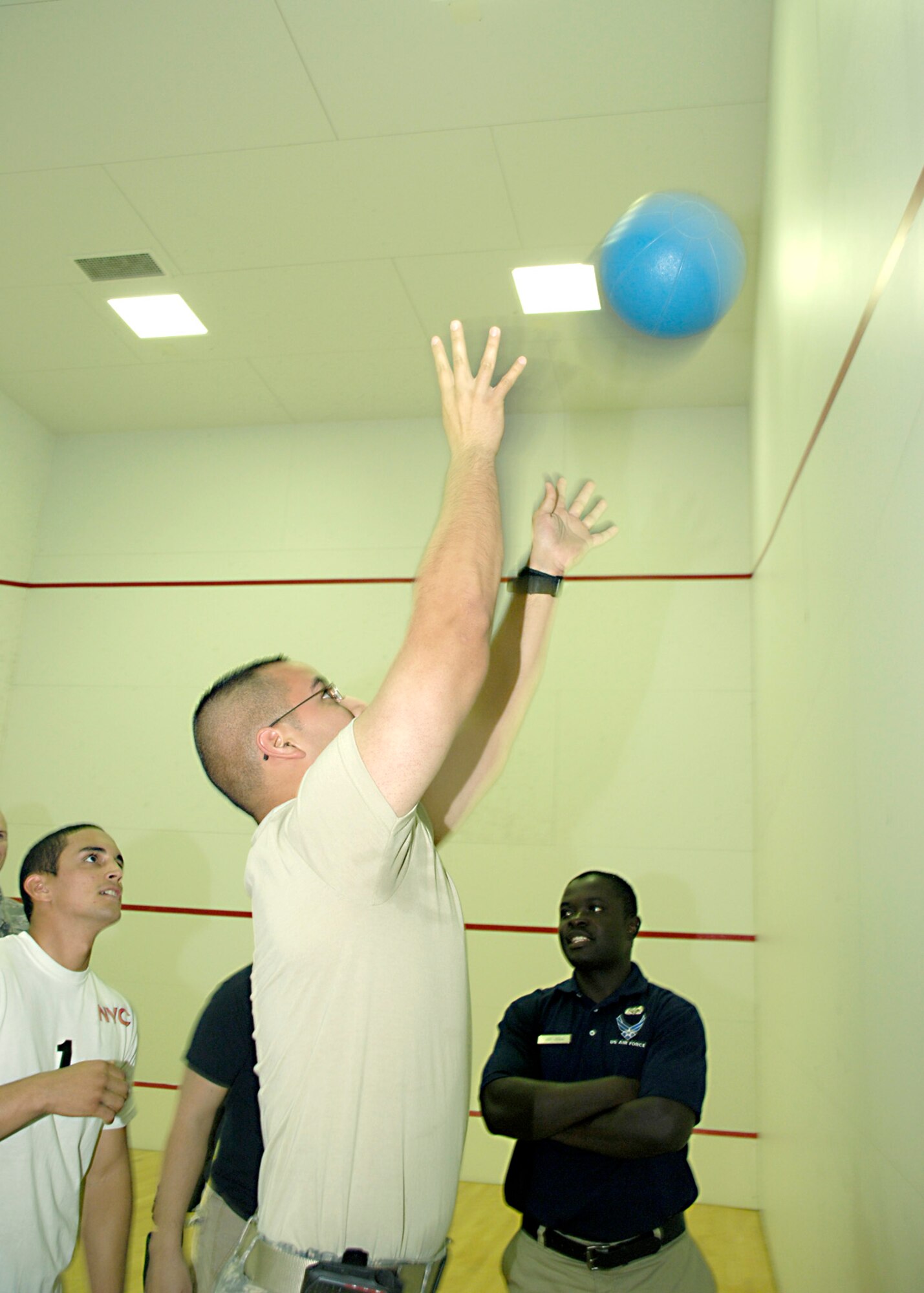 A member of the 49th Medical Group participates in a tie breaker which consists of throwing a medicine ball above a line at Holloman Air Force Base, N.M., Aug. 27. The medical group completed 102 repetitions making them the current Iron Airman champions. (U.S. Air Force photo/ Senior Airman Tiffany Trojca)