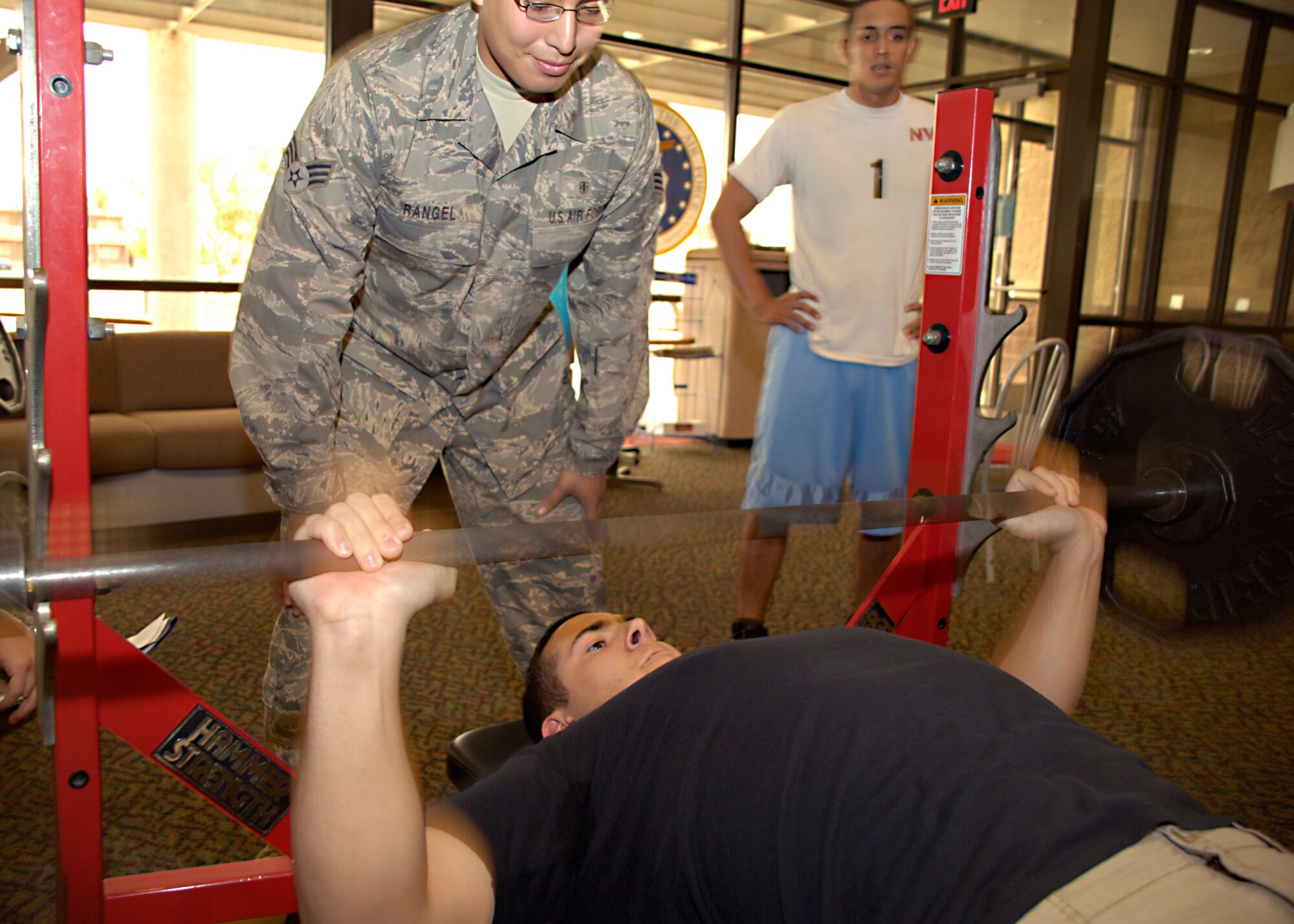 Senior Airman Anthony Hayner, 49th Medical Group, does 40 bench press repetitions during the Iron Airman Challenge at Holloman Air Force Base, N.M., Aug. 27. Airman Hayner competed with a team of five others. (U.S. Air Force photo/ Senior Airman Tiffany Trojca)