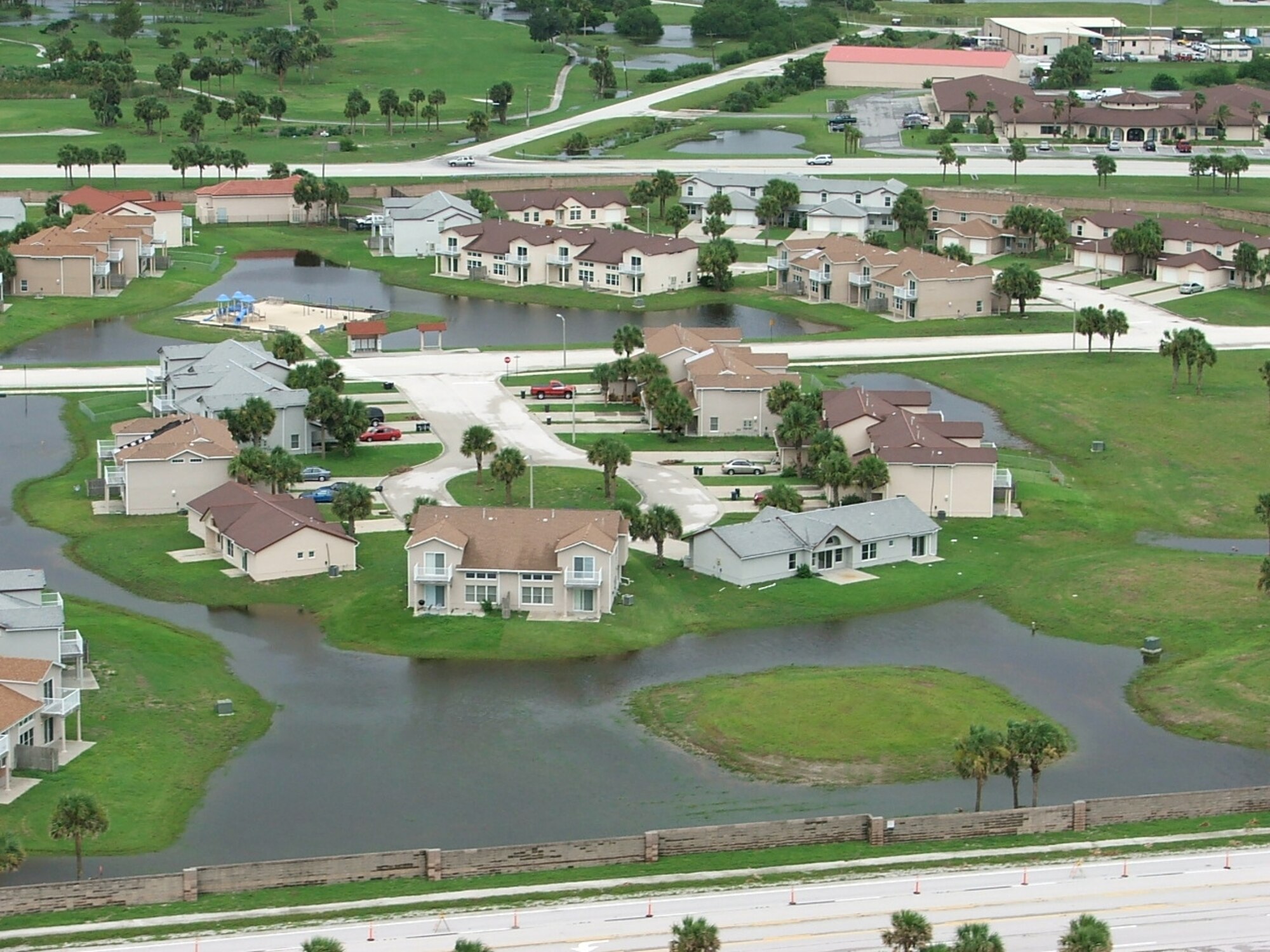 Residents of Central Housing awoke to an almost "moat-like" neighborhood following Tropical Storm Fay's visit Aug. 20. "I was comforted because everyone seemed to do everything perfectly, even when we had to deal with a storm that was acting like a houseguest who doesn't know when it's time to go home," said Brig. Gen. Susan Helms, 45th Space Wing commander. (U.S. Air Force photo by Bill Lutter)