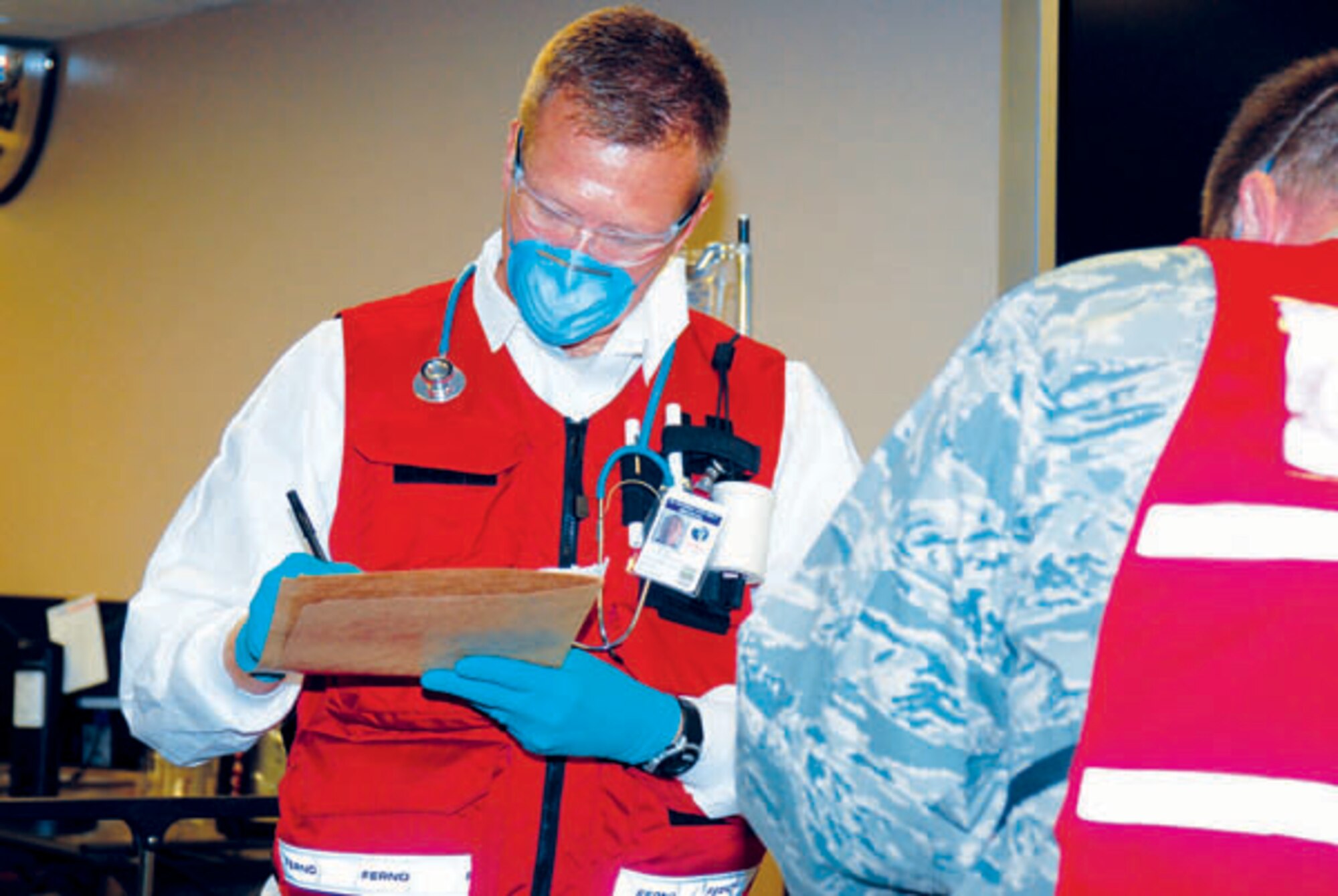 A patient waits to go into the decontamination line Friday during the MERCAT. (Photo by Bernie Ernst)