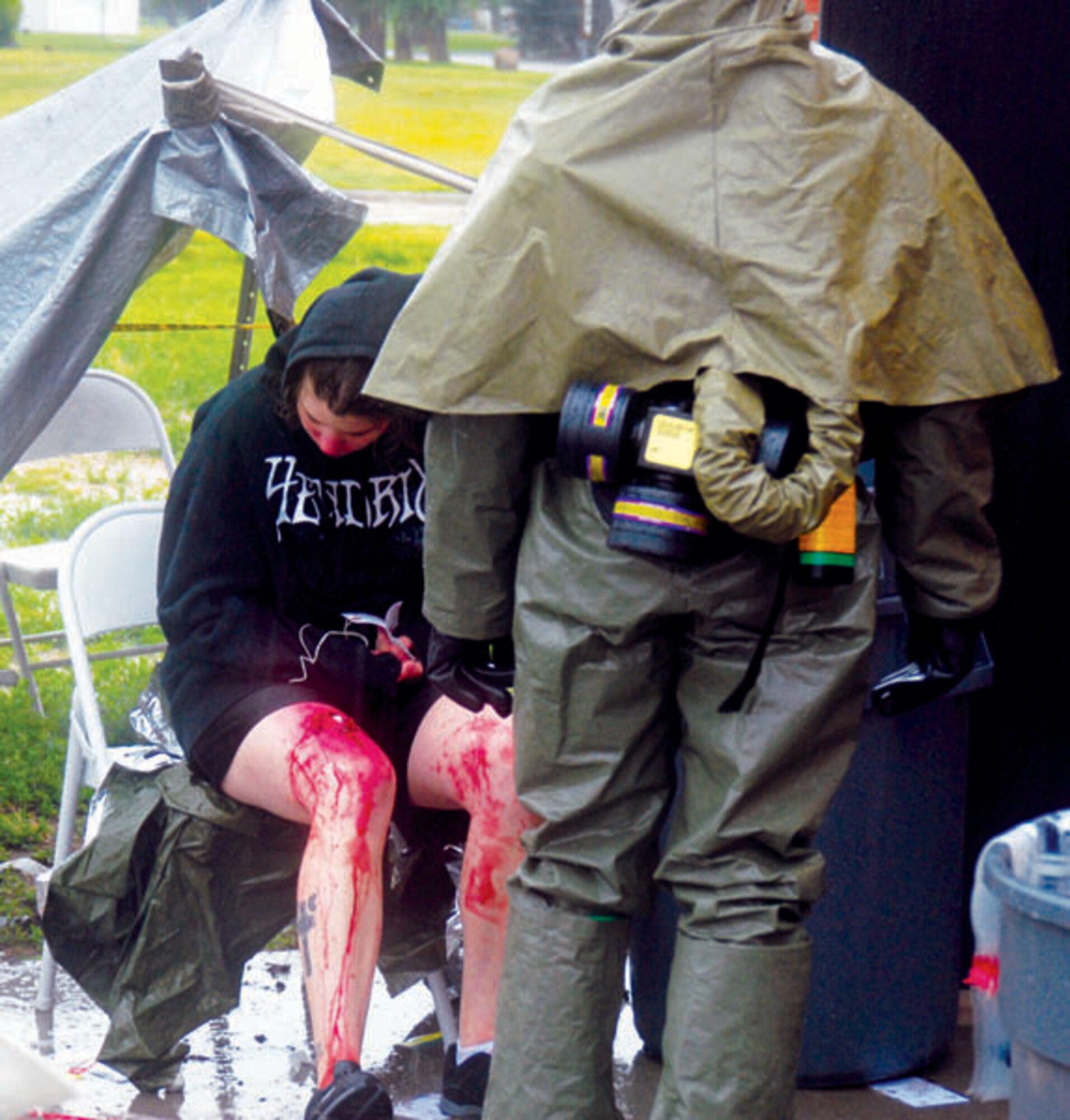 A medical team member checks a patient before admission into the decontamination line Friday during the MERCAT. (Photo by Bernie Ernst)