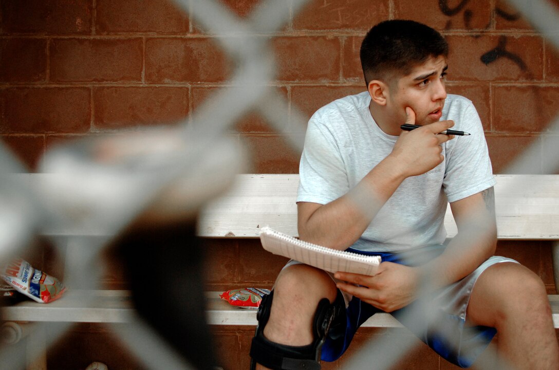 LANGLEY AIR FORCE BASE, Va. -- Senior Airman Ricardo Hernandez, 480th Intelligence Wing, records the score for softball game between the 480th Intelligence Wing and 1st Equipment Maintenance Squadron Aug. 26.  Senior Airman Hernandez watched the 1st EMS defeat the 480th 12-6 in a double header that featured two other teams as the Langley softball season comes to a close.  (U.S. Air Force photo/Senior Airman Vernon Young)