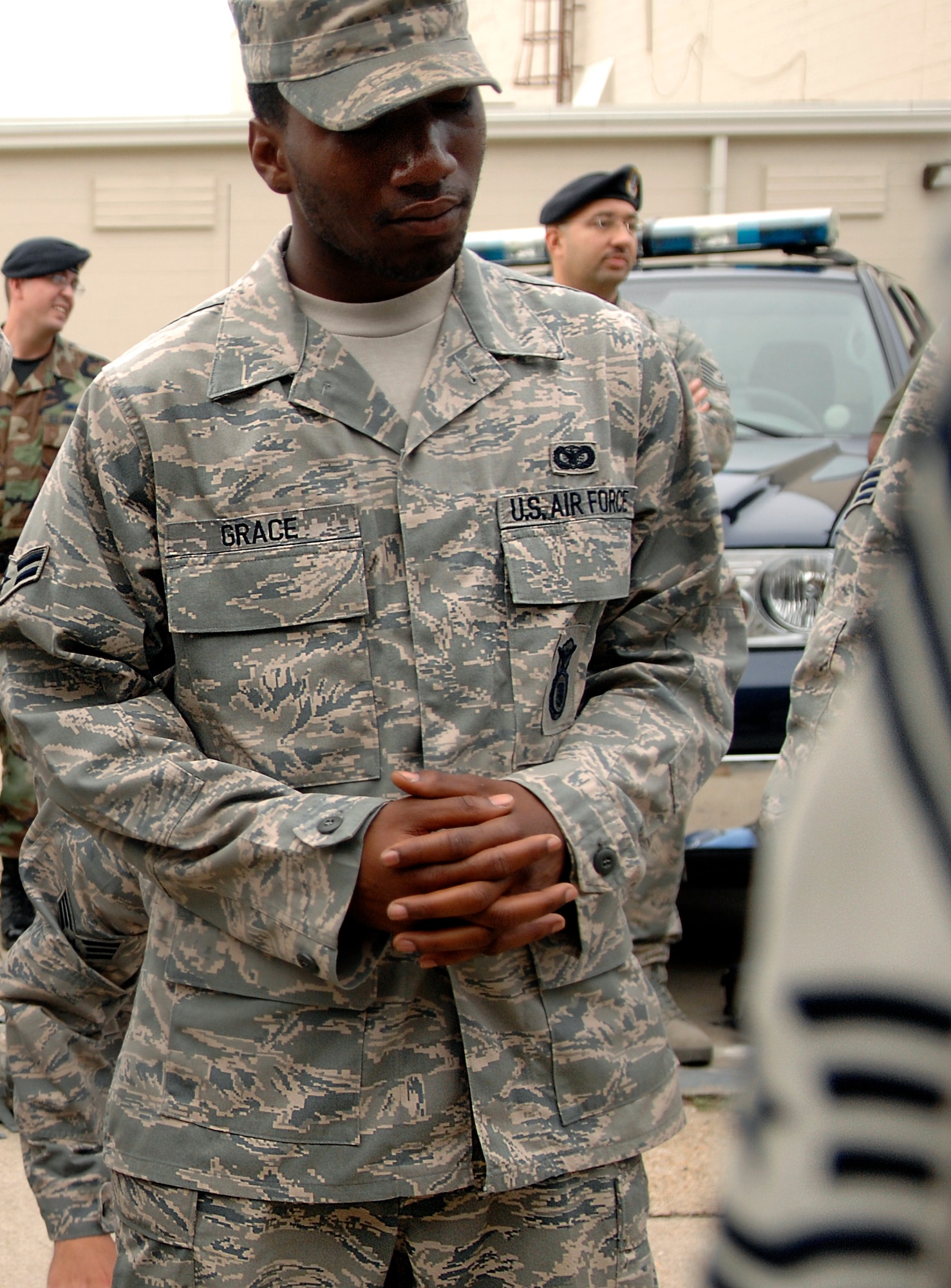 LANGLEY AIR FORCE BASE, Va. -- Airman 1st Class Antonio Grace, 1st Security Forces Squadron, listens during a briefing before deploying to Joint Base Balad, Iraq, Aug. 28.  Airman Grace previously deployed in support of the Global War on Terrorism in 2007.  The 13-man team from the 1st SFS is tasked along with 800 Airmen Air Force-wide to relieve Army Soldiers from entry control point and tower patrol duties at Joint Base Balad.  (U.S. Air Force photo/Senior Airman Vernon Young)