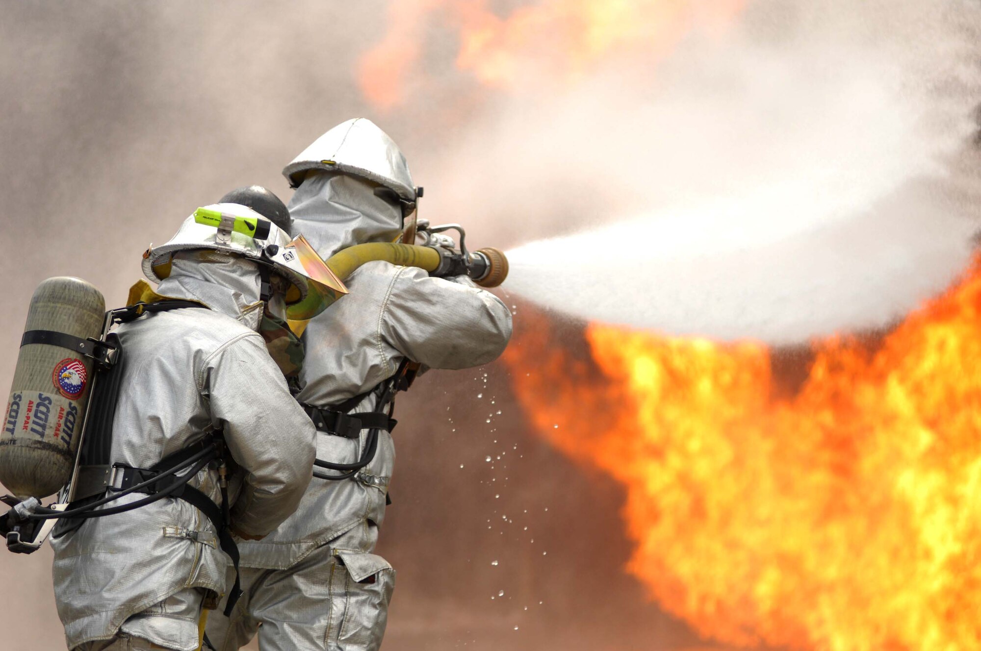 SHAW AIR FORCE BASE, S.C. -- 20th Civil Engineer Squadron firefighters extinguish a controlled aircraft fire during a Phase II Operational Readiness Exercise Aug. 26. An ORE helps firefighters along with other 20th Fighter Wing Airmen prepare for tasks they could experience during real world deployments. (U.S. Air Force photo/Senior Airman Matthew Davis) 