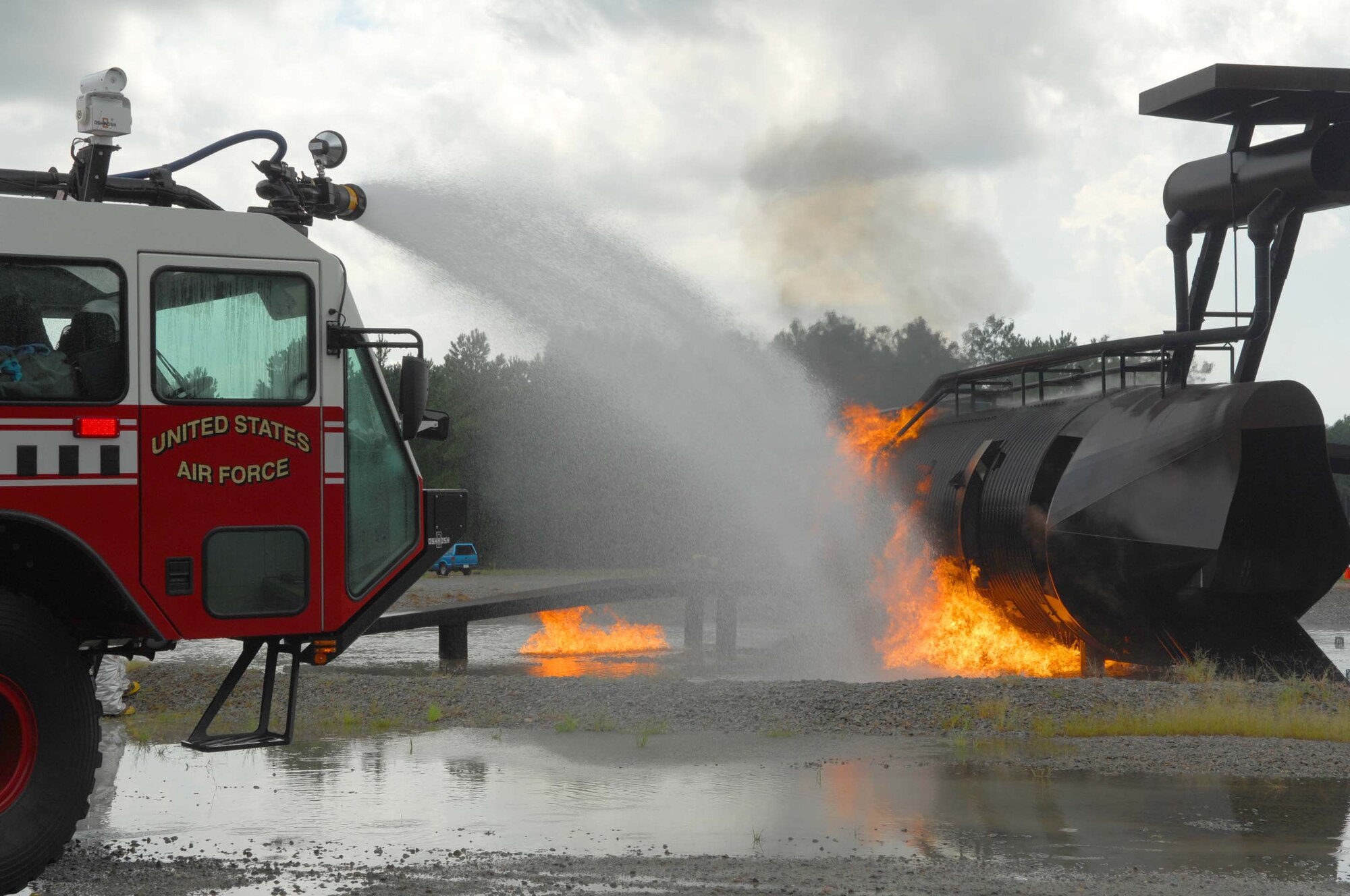 SHAW AIR FORCE BASE, S.C. -- Firefighters from the 20th Civil Engineer Squadron extinguish a burning aircraft during a Phase II Operational Readiness Exercise Aug. 26. OREs provide vital training and prepare Airmen for worldwide deployment. (U.S. Air Force photo/Senior Airman William Coleman)