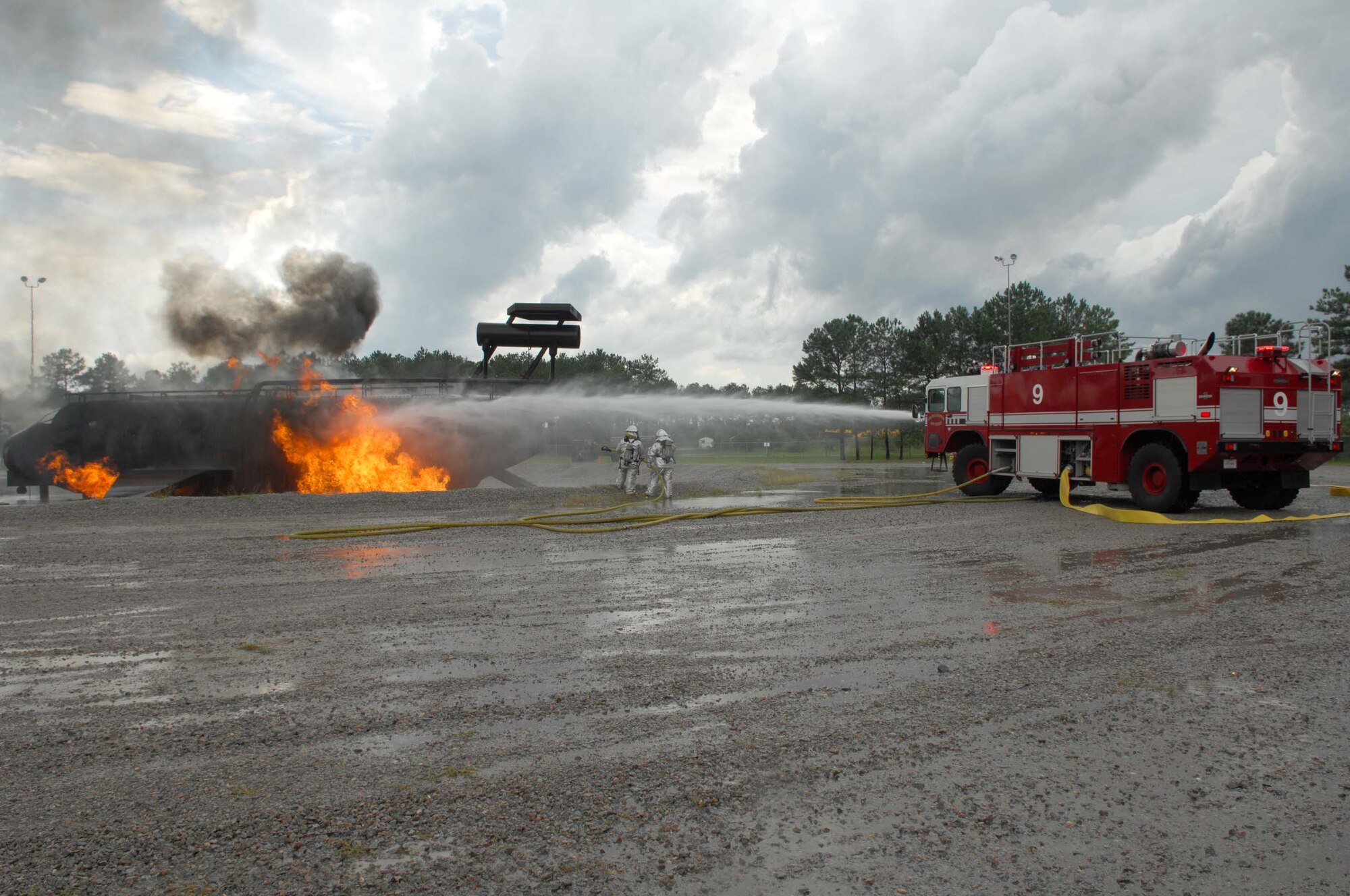 SHAW AIR FORCE BASE, S.C. -- Firefighters from the 20th Civil Engineer Squadron extinguish a burning aircraft during a Phase II Operational Readiness Exercise Aug. 26. OREs provide vital training and prepare Airmen for worldwide deployment. (U.S. Air Force photo/Senior Airman William Coleman)