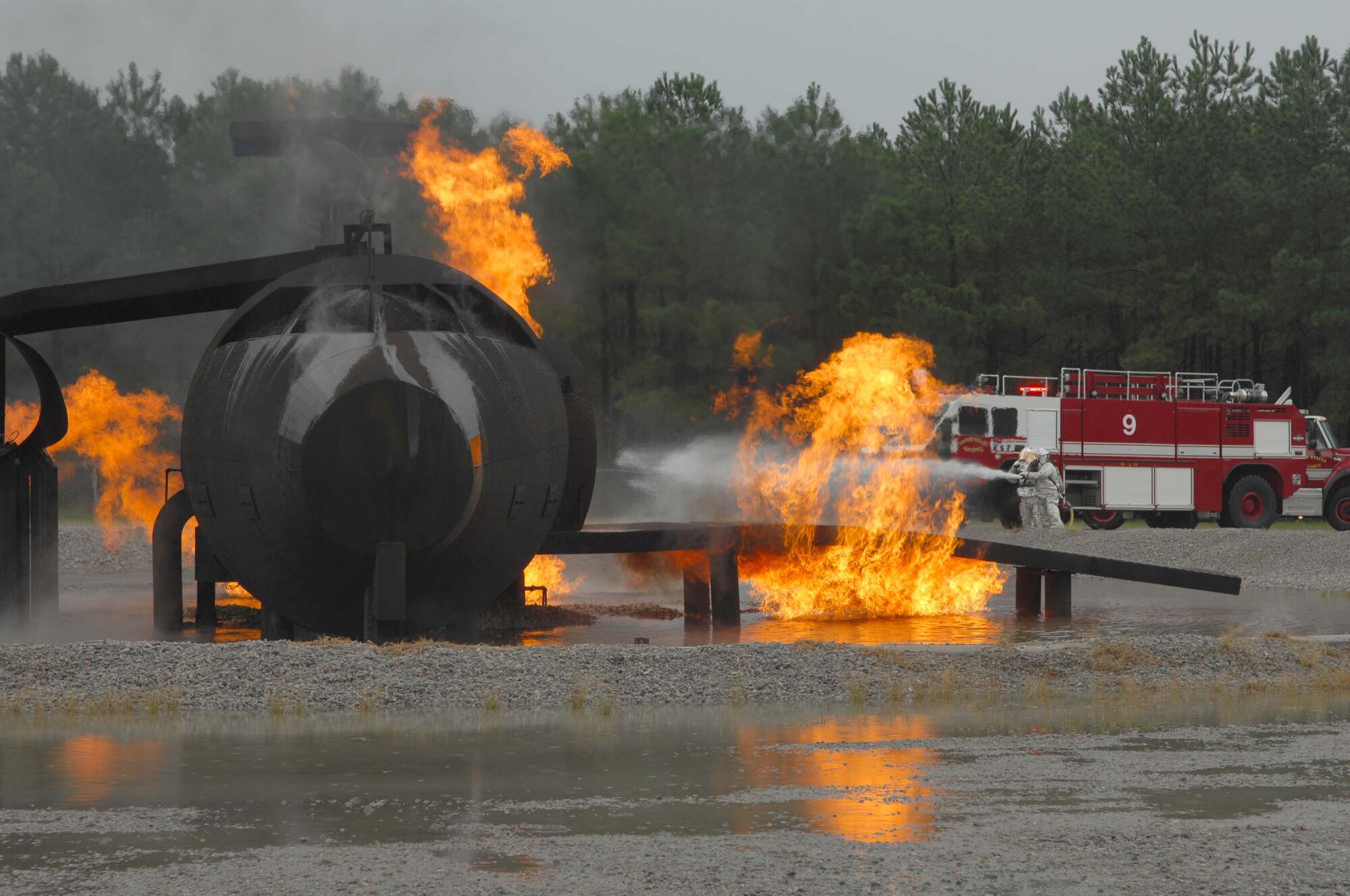 SHAW AIR FORCE BASE, S.C. -- Firefighters from the 20th Civil Engineer Squadron extinguish a burning aircraft during a Phase II Operational Readiness Exercise Aug. 26. OREs provide vital training and prepare Airmen for worldwide deployment. (U.S. Air Force photo/Senior Airman William Coleman)