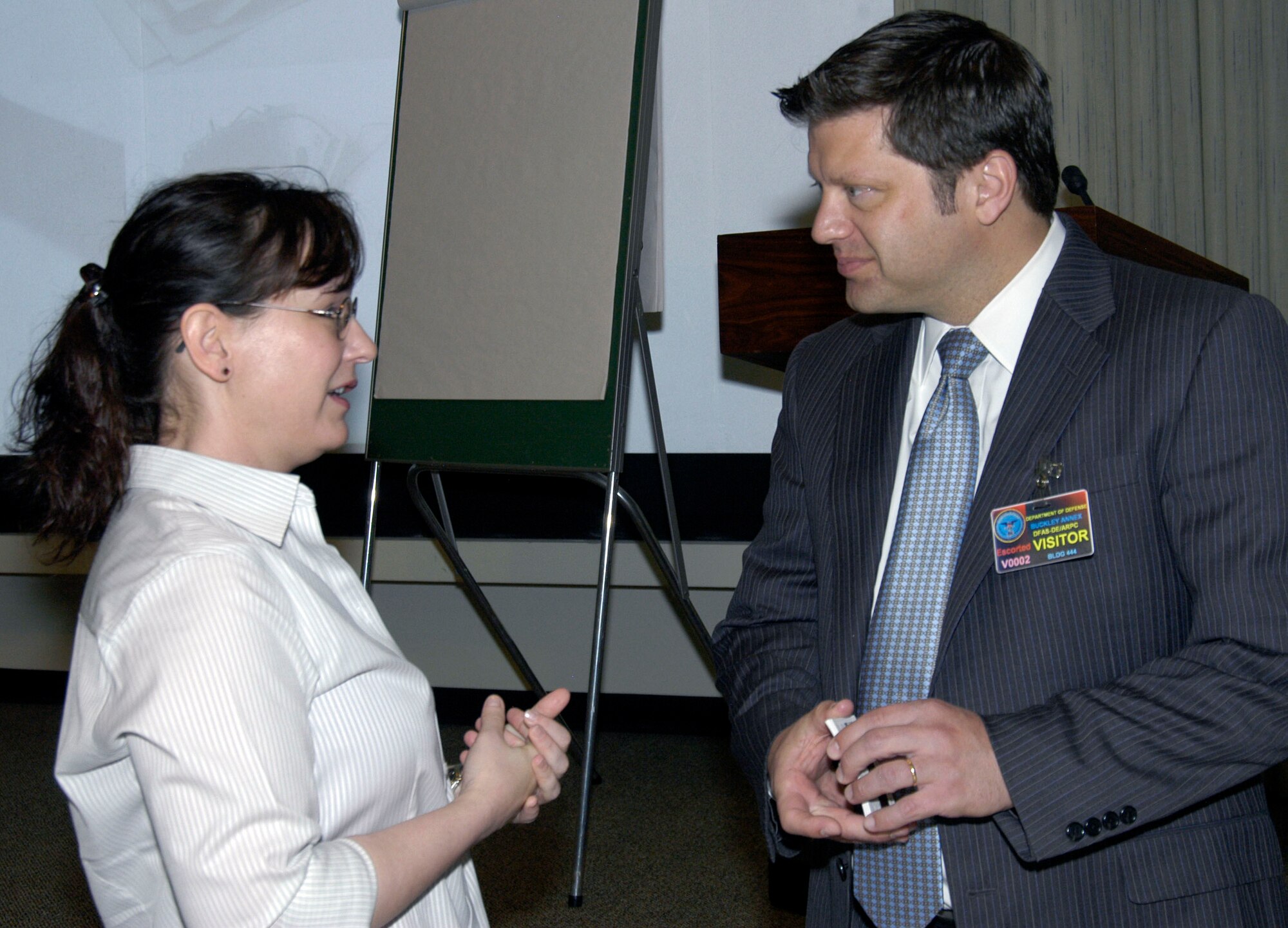 Michelle Verges, DPC, talks with Dennis Marshall of Personal Benefit Services of Colorado, during a pre-retirement seminar at ARPC on Aug. 28. Mr. Marshall, an investment advisor, conducted the two and a half day seminar for nearly 50 ARPC civilian employees. (U.S. Air Force photo/Mike Molina)