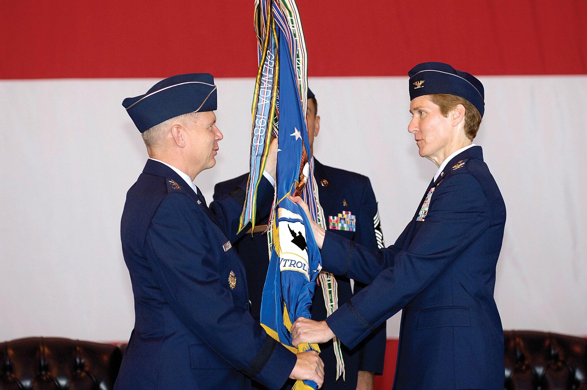 In an Aug. 27 ceremony witnessed by hundreds of Airmen, Civilians and community leaders, Lt. Gen. Robert Elder Jr. confers command of the 552nd Air Control Wing to Col. Patricia Hoffman.  General Elder Jr. is the commander of the 8th Air Force, Barksdale Air Force Base, La., and the Joint Functional Component commander for Global Strike and Integration, U.S. Strategic Command, Offutt AFB, Neb. (Air Force photo/Margo Wright)
