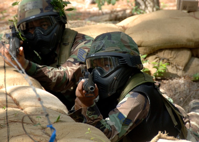 Tech. Sgt. Jeff Mercer and Senior Airman Zina Wright guard a defensive fighting position during Expeditionary Combat Skills Training on Charleston AFB Aug. 26. ECST is required for Airmen who are deploying to hostile areas where combat knowledge and skills are required. Sergeant Mercer and Airman Wright are with the 437th Logistics Readiness Squadron. (U.S. Air Force photo/Airman 1st Class Timothy Taylor)