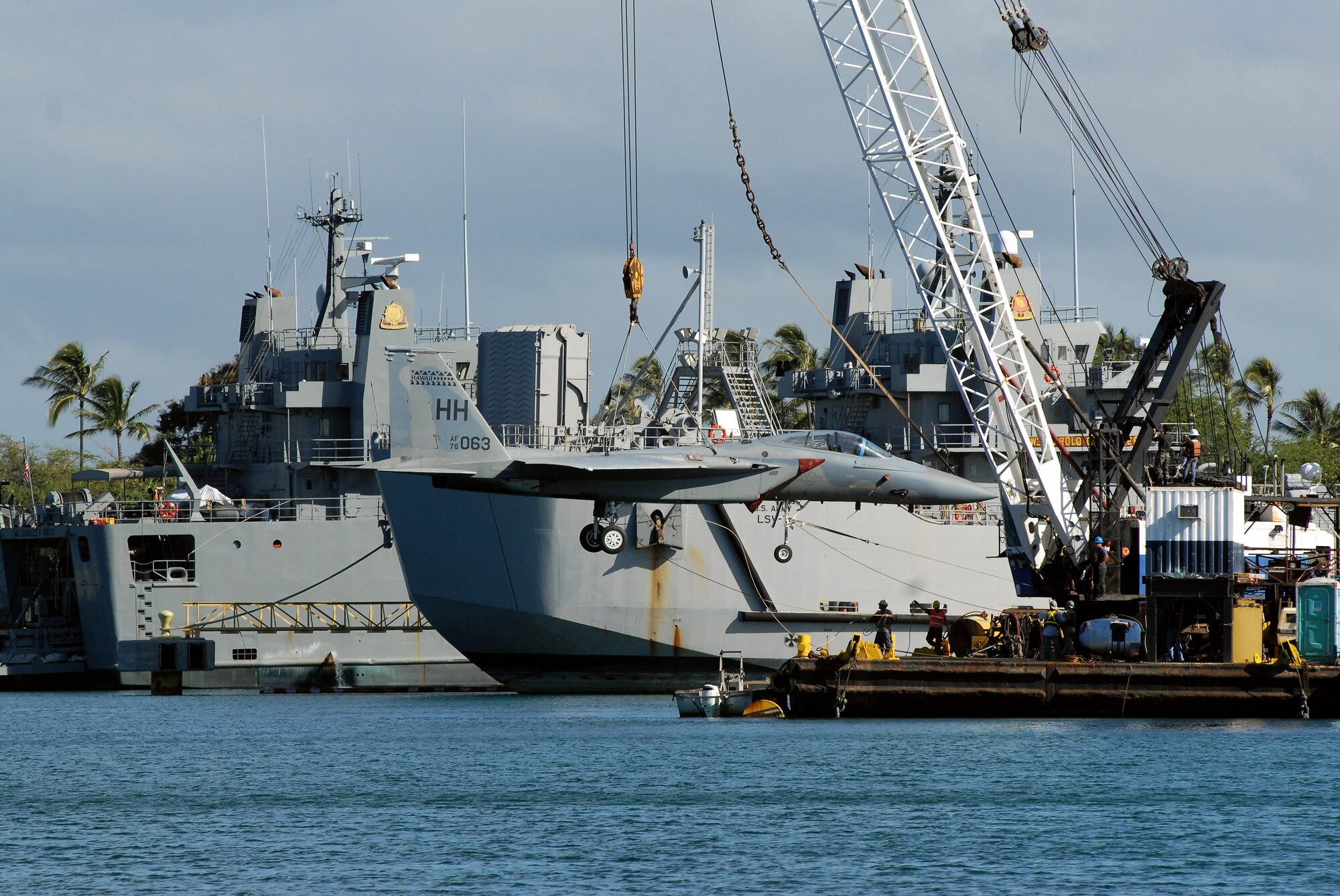 An F-15 Eagle gets a lift from a barge crane for its vogue to the Pacific Aviation Museum Pearl Harbor on Ford Island in Hawaii Aug. 26 at the cargo pier at Hickam Air Force Base, Hawaii. The aircraft was from the 199th Fighter Squadron of the Hawaii Air National Guard. (U.S. Air Force photo/Master Sgt. Robert Burgess) 
