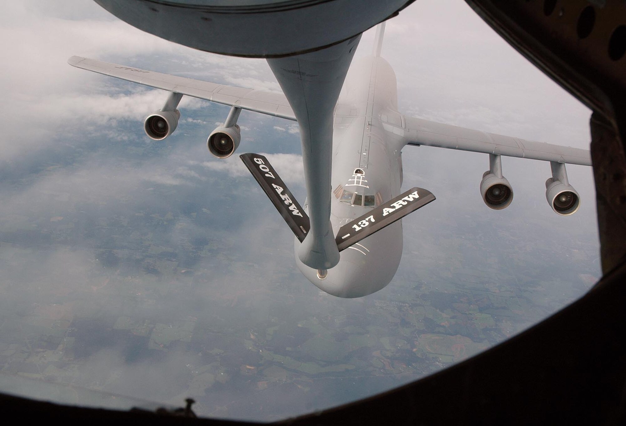 Crew members aboard a KC-135 assigned to the 507th Air Refueling Wing out of Tinker Air Force Base, Okla., get in position to refuel a C-5 Galaxy assigned to Wright-Patterson Air Force Base, Ohio, somewhere in the skies between Wright-Patterson AFB and Eglin AFB, Fla., Aug. 7. (Air Force photo by Col. James Eilers)