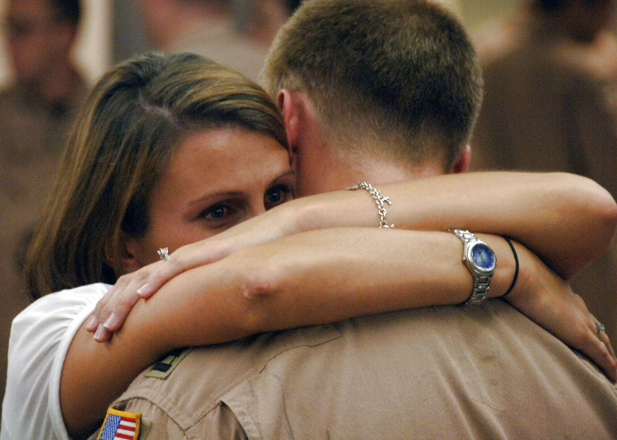 Fianc? Jessica McDonnell embraces Capt. Alexander Lammi prior to the 15th Airlift Squadron's departure Aug. 27 at Charleston Air Force Base, S.C. Members from the 15th AS are deploying to Southwest Asia as part of operations Enduring Freedom and Iraqi Freedom. Captain Lammi is a pilot with the 15th AS. (U.S. Air Force photo/Airman 1st Class Timothy Taylor) 
