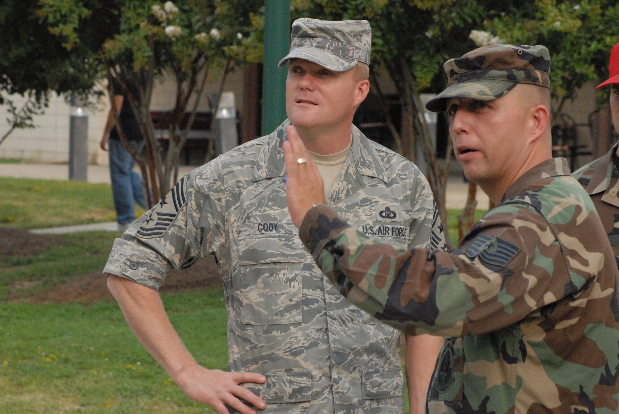 Tech. Sgt. Donald Lundy, 43rd Civil Engineer Squadron, maps out different sections of the dormitories to 18th Air Force Command Chief Master Sgt. James Cody during a visit to Pope Aug. 21. Chief Cody also spoke at the senior non-commissioned officer induction Aug. 22. (U.S. Air Force Photo by Staff Sgt. Jon LaDue)