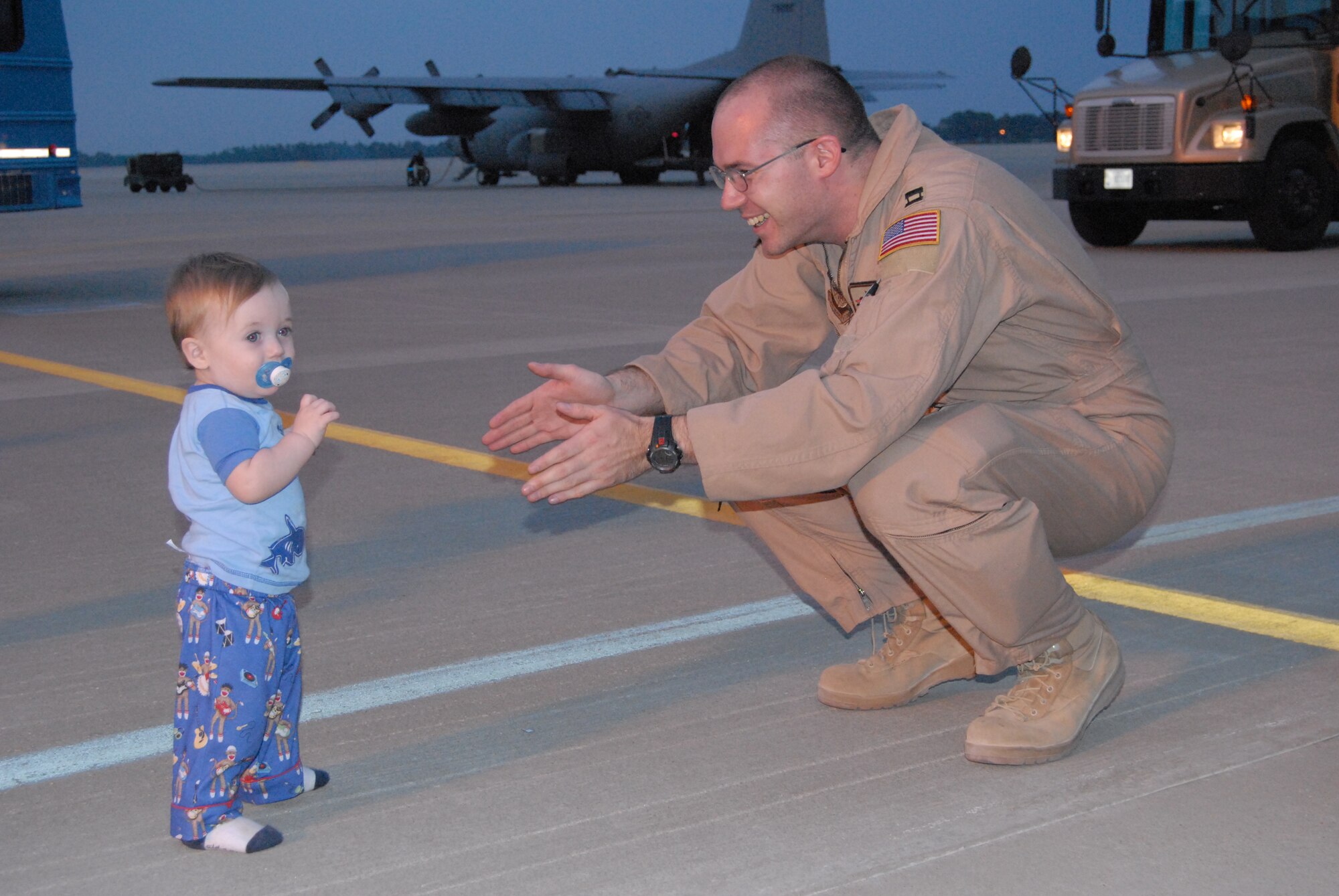 Capt. Kevin Stefanich, 2nd Airlift Squadron, greets his son Aug. 21 after returning from a 120-day deployment to Southwest Asia. (U.S. Air Force Photo by Staff Sgt. Jon LaDue)
