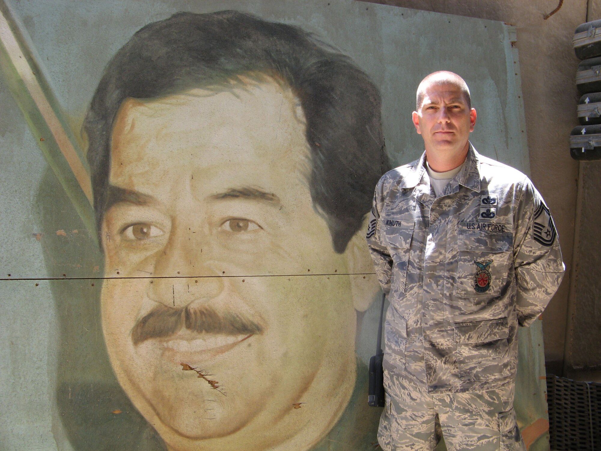 SEYMOUR JOHNSON AIR FORCE BASE, N.C. -- Senior Master Sgt. Scott Knuth, a Reservist with the 916th Civil Engineer Squadron, stands next to a relic near Balad, Iraq during his  deployment in support of Operation Iraqi Freedom earlier this year. Sgt. Knuth recently spoke to the San-Lee Sunrise Rotarian Club about his service as a firefighter in Iraq. In his civilian job, Sgt. Knuth is the battalion commander for the Sanford Fire Dept.