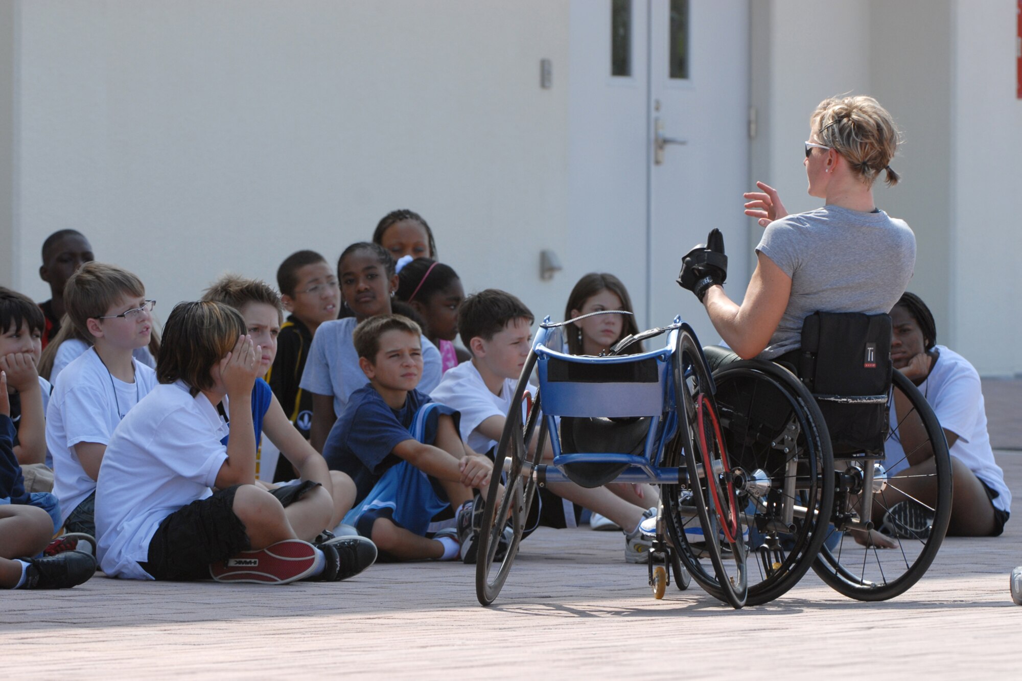 U.S. Paralympian Cheri Blauwet answers questions from a group of middle school students  at Kadena Air Base, Japan Aug. 28. More than 100 athletes and support staff from the U.S. Paralympics track and field and swim teams arrived at Kadena Aug. 24 to live and train for the next ten days in preparation for the 2008 Paralympic Games held in Beijing, China Sept. 6. (U.S. Air Force photo/Airman 1st Class Chad Warren)