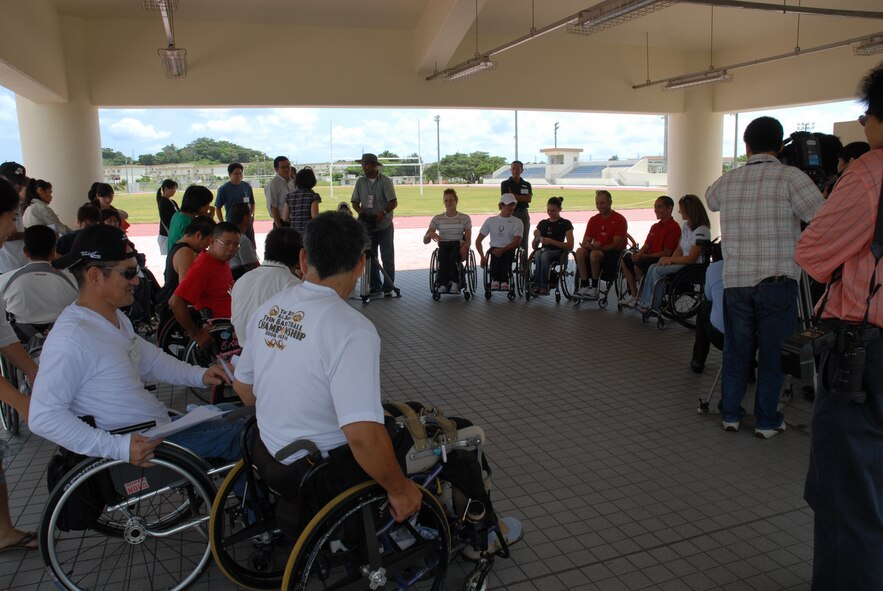 KADENA AIR BASE, Japan -- Members of the U.S. Paralympics team are introduced to local Okinawan Paralympians Aug. 27. More than 100 athletes and support staff from the U.S. Paralympics track and field and swim teams arrived Aug. 24 to live and train for the next 10 days in preparation for the 2008 Paralympic Games held in Beijing, China Sept. 6-17. (U.S. Air Force photo/Airman 1st Class Chad Warren) 