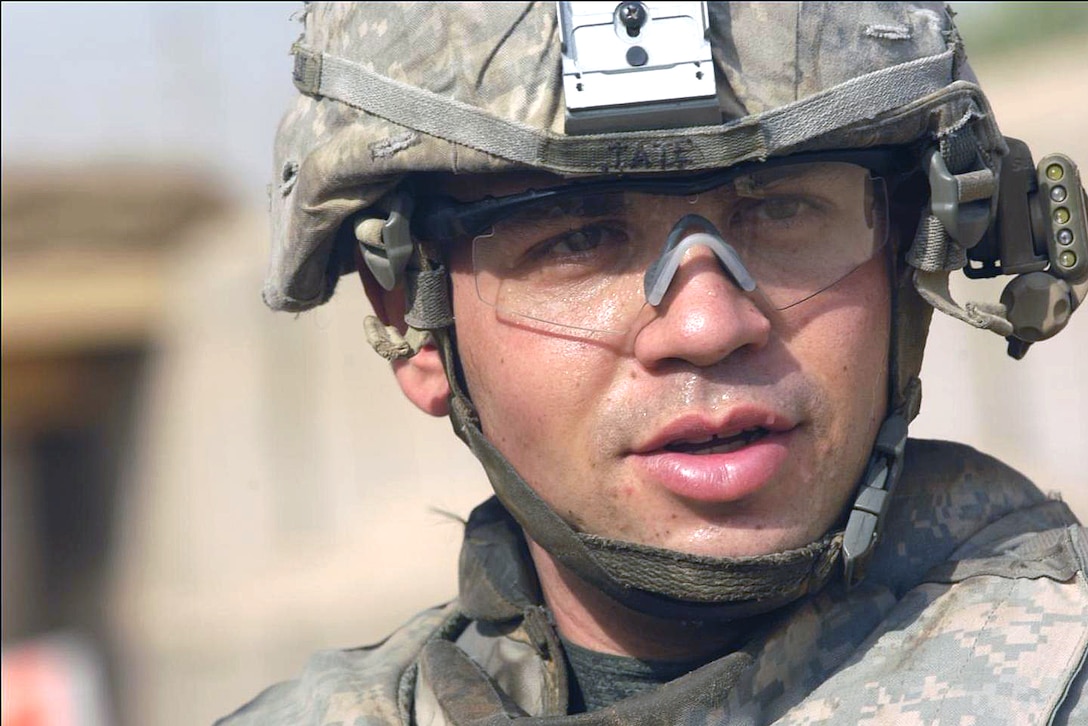 U.S. Army Sgt. Hunter Tate looks back after seeing that his advanced combat optical gunsight has been sighted in properly at a firing range in Forward Operating Base Hawk, Iraq, Aug. 22, 2008. The soldiers are assigned to Comanche Troop, 4th Squadron, 10th Cavalry, 4th Infantry Division.