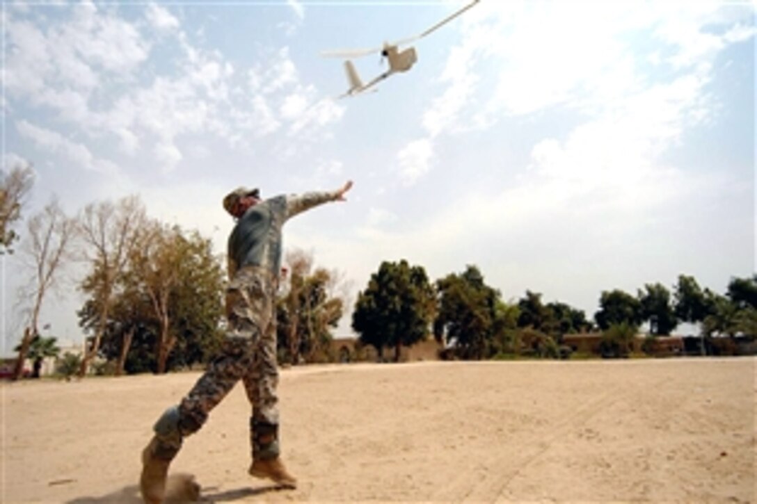U.S. Army Cpl. Billy McCoy launches a RQ-11B "Raven,"  a Small Unmanned Aerial System that provides Intelligence Reconnaissance Surveillance, on Joint Security Station Doura, Baghdad, Iraq, Aug. 25, 2008. McCoy and other soldiers are assigned to the 10th Mountain Division's  Company D, 2nd Battalion, 4th Infantry Regiment. 