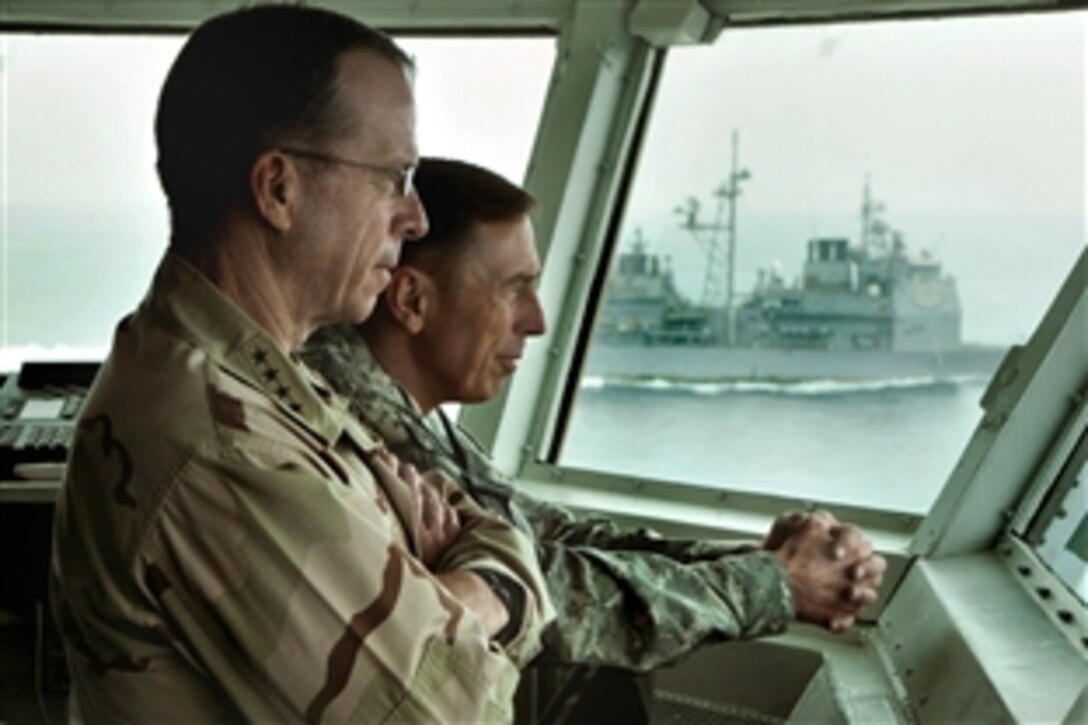 U.S. Navy Adm. Mike Mullen, left front, chairman of the Joint Chiefs of Staff, and U.S. Army Gen. David H. Petraeus, commander, Multinational Force Iraq, observe flight operations from the flag
bridge during a visit to USS Abraham Lincoln, in the North Arabian Sea, Aug. 27, 2008.  The USS 
Lincoln is deployed to the U.S. 5th Fleet area of operations to support Operations Iraqi Freedom and Enduring Freedom as well as Maritime Security Operations. 
