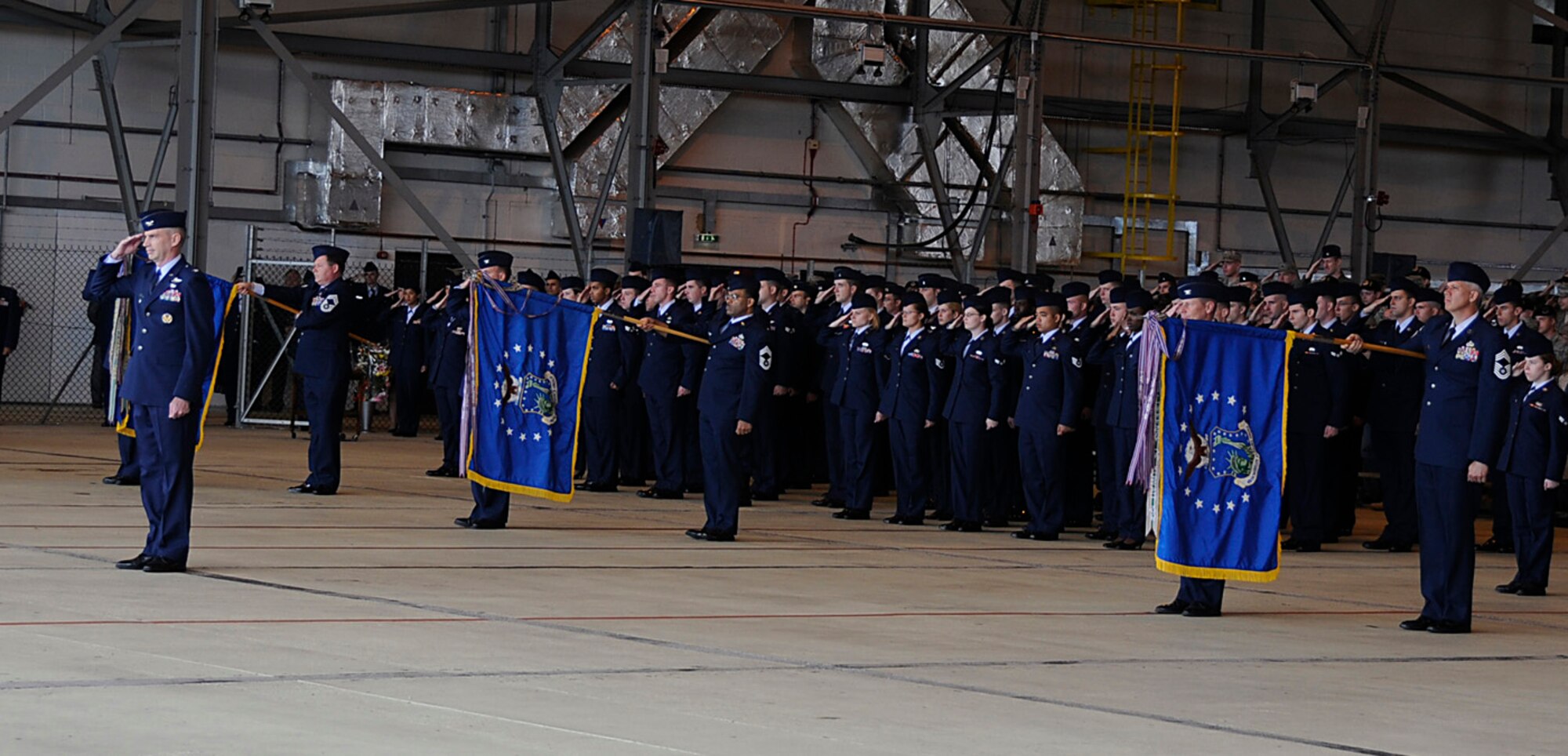 The 48 Fighter Wing renders its first salute to Col. Jay Silveria, 48th Fighter Wing commander, during the assumption of command ceremony at RAF Lakenheath, Aug 29. (U.S. Air Force photo by Senior Airman Brian J. Ellis)