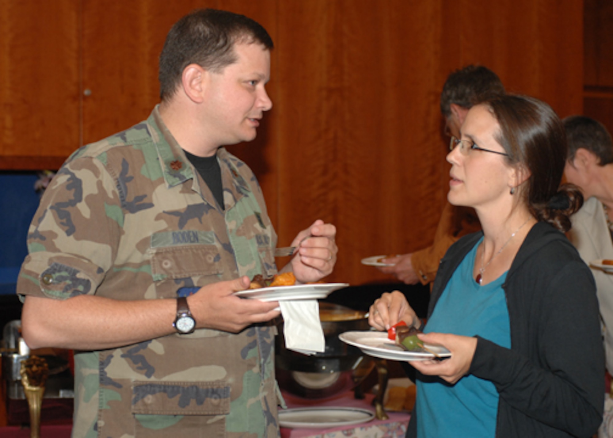 SPANGDAHLEM AIR BASE, Germany – Maj. Stephen Boden, 52nd Medical Operations Squadron, 52nd Fighter Wing, speaks with a Host Nation Council Member about how local hospitals and clinics can work together with the Spangdahlem Air Base community to make medical care more efficient to military members and their families at Club Eifel August 22, 2008. (U.S. Air Force photo by Airman 1st Class Jenifer H. Calhoun)
