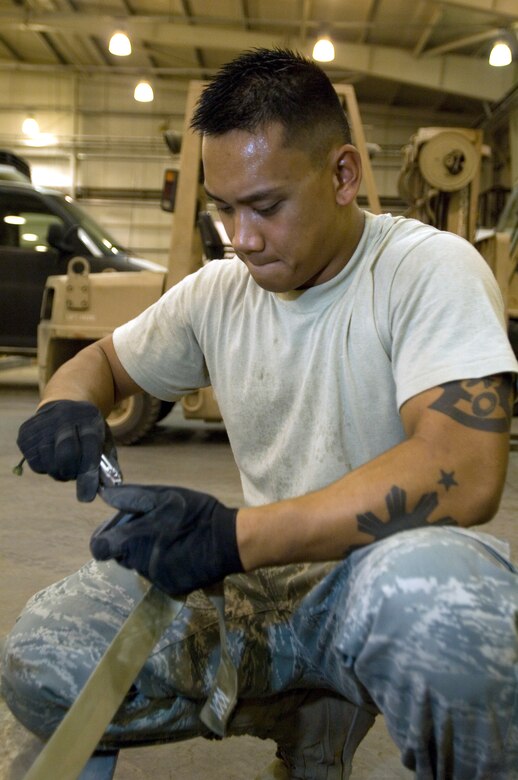 JOINT BASE BALAD, Iraq -- Senior Airman Derek Dumlao builds a palette here Aug. 24. Airman Dumlao completed a new Air Force Reserve seasoning training program prior to deploying here. The program allows Airmen to voluntarily remain on active duty for upgrade training, finishing it in three months instead of 14 to 16 months. Dumlao, an aerial porter with the 332nd Expeditionary Logistics Readiness Squadron here, is deployed from the 624th Regional Support Group at Hickam Air Force Base, Hawaii. (U.S. Air Force photo/Airman 1st Class Jason Epley)