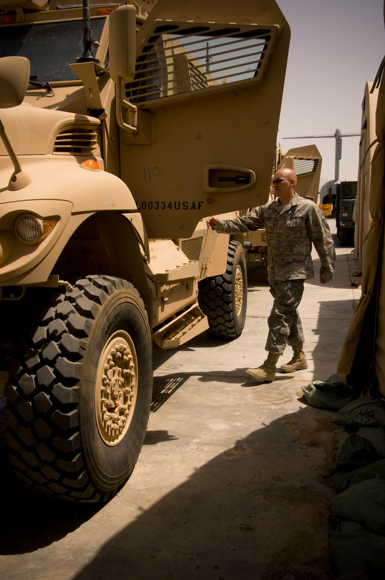 BAGRAM AIR FIELD, Afghanistsan -- Master Sgt. Brian Spalinger, 455th Expeditionary Logistics Readiness Squadron, performs a serviceability inspection on the MaxxPro mine-resistant ambush-protected vehicle in the vehicle maintenance yard at Bagram Air Field, Afghanistan. Airmen in the 455th Air Expeditionary Wing welcomed the first of many MRAPs designed to protect them from roadside bombs while conducting missions outside the wire. (U.S. Air Force photo by Staff Sgt. Rachel Martinez/Released)