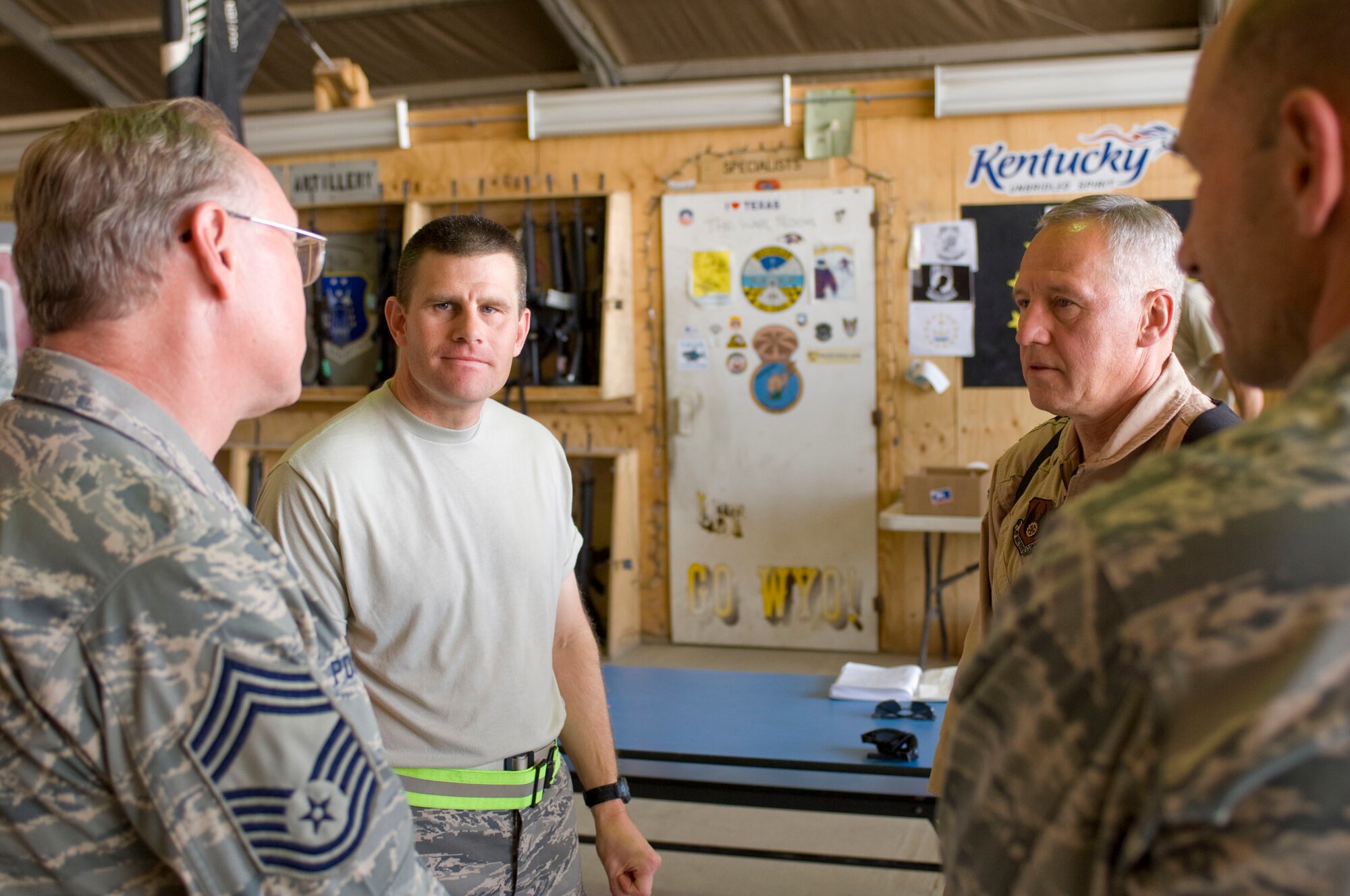 BAGRAM AIR FIELD, Afghanistan -- General Bruce Carlson, Air Force Materiel Command commander, visits with Air National Guard Chief Master Sgt. Martin Pokrzywa, C-130J Aircraft Maintenance Unit superintendent (left), and ANG Maj. Ronald Cloutier, C-130J AMU commander, here on August 22, 2008. Chief Pokrzywa is deployed from the 135th Maintenance Squadron, Martin State Airport, Md., and Major Cloutier is deployed from the 143rd Maintenance Squadron,  Quonset-Holland ANG Base, RI. (U.S. Air Force photo by Staff Sgt. Samuel Morse/Released)